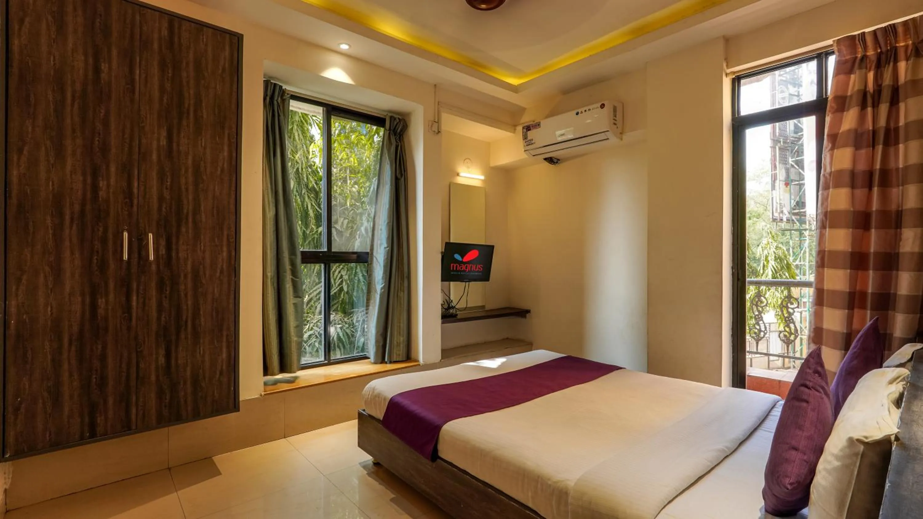 Bed in Magnus Calypso Suites Viman Nagar