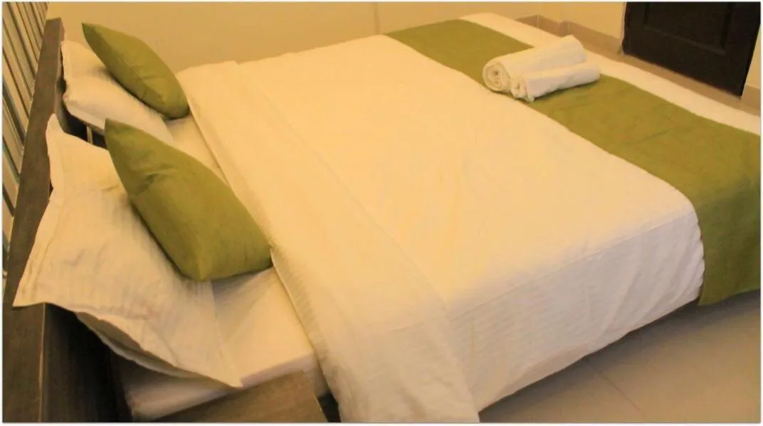 Bed in Magnus Calypso Suites Viman Nagar