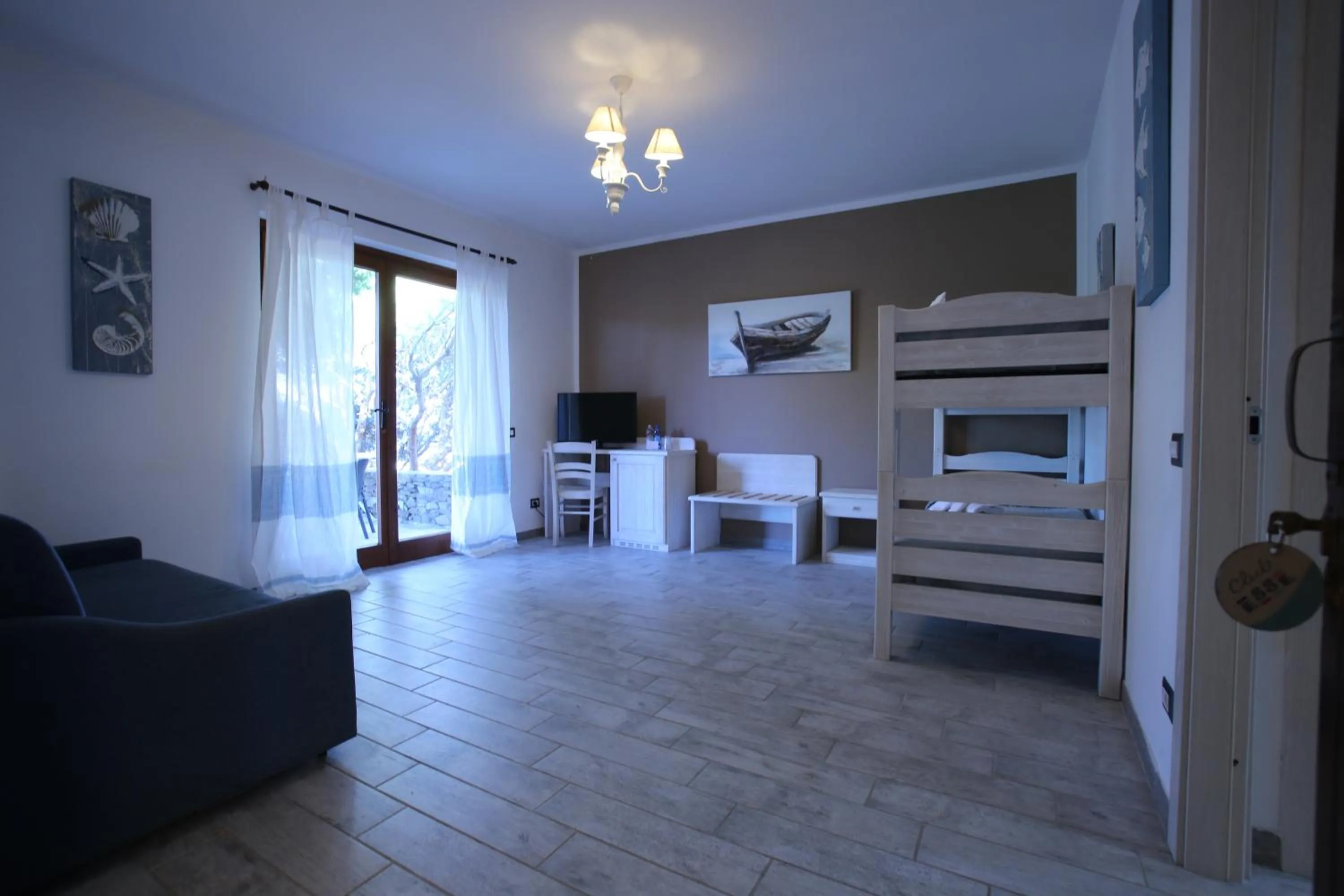 Living room, Bed in Club Esse Sporting