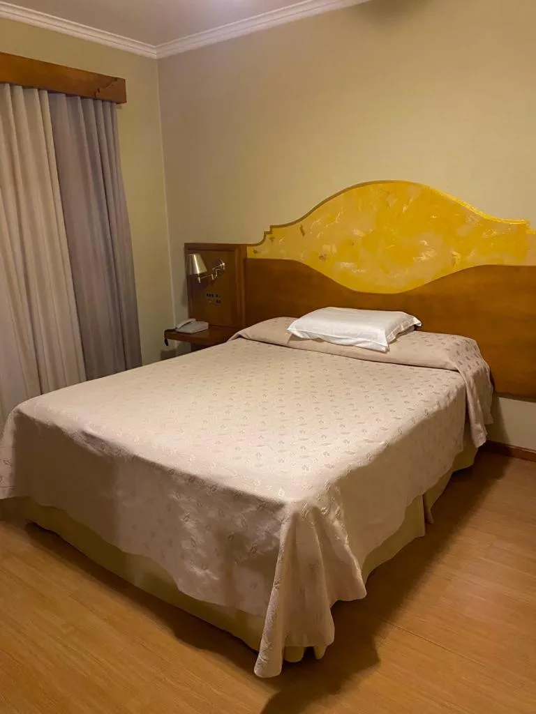 Bed in Pousada Vovó Carolina