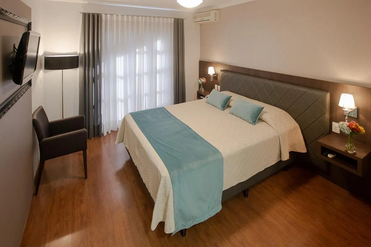 Bed in Pousada Vovó Carolina