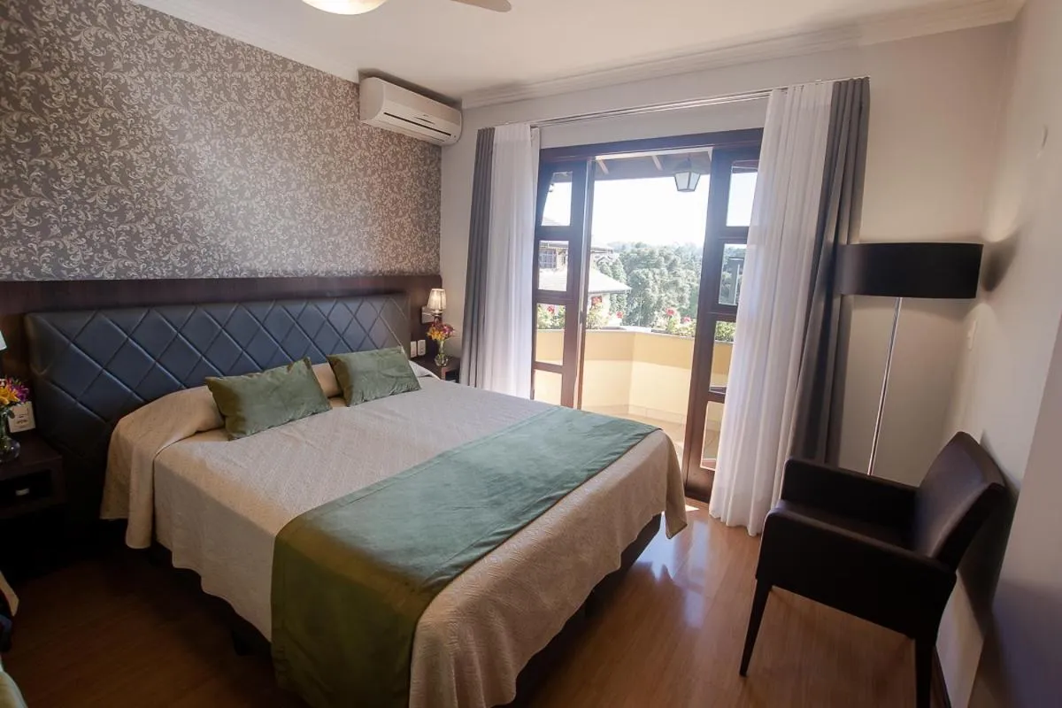 Bed in Pousada Vovó Carolina