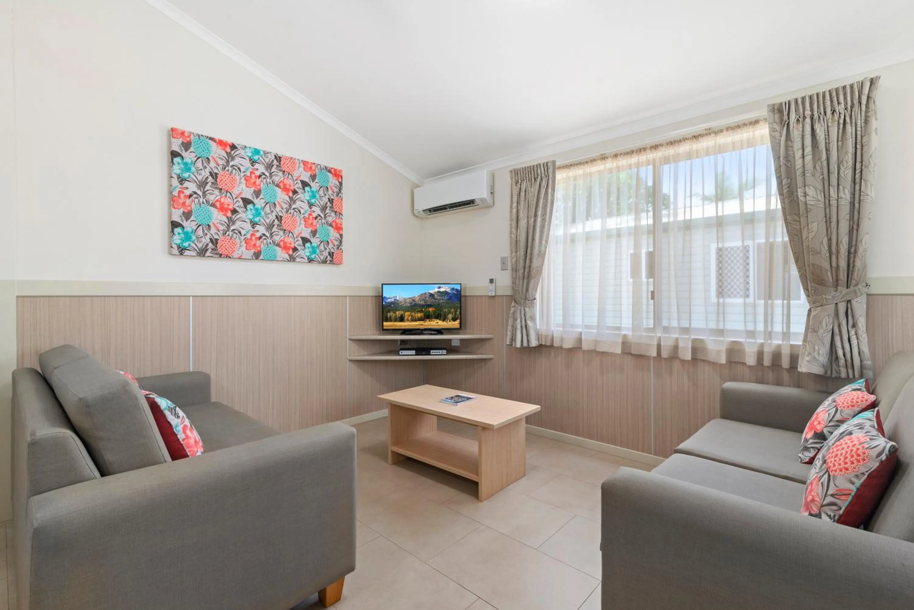 Living room in Ashmore Palms Holiday Village