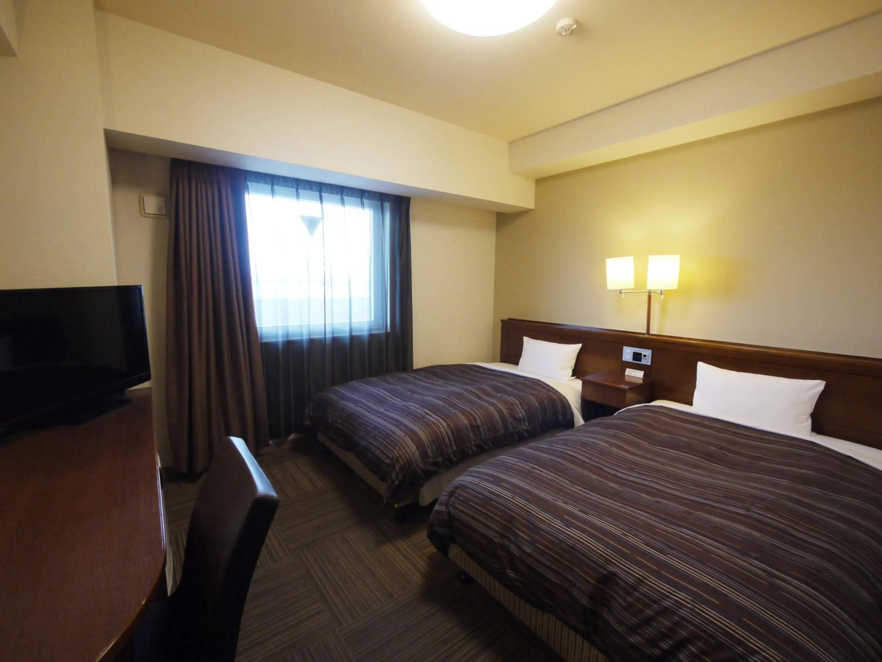 Photo of the whole room, Bed in Hotel Route-Inn Mito Kencho-mae
