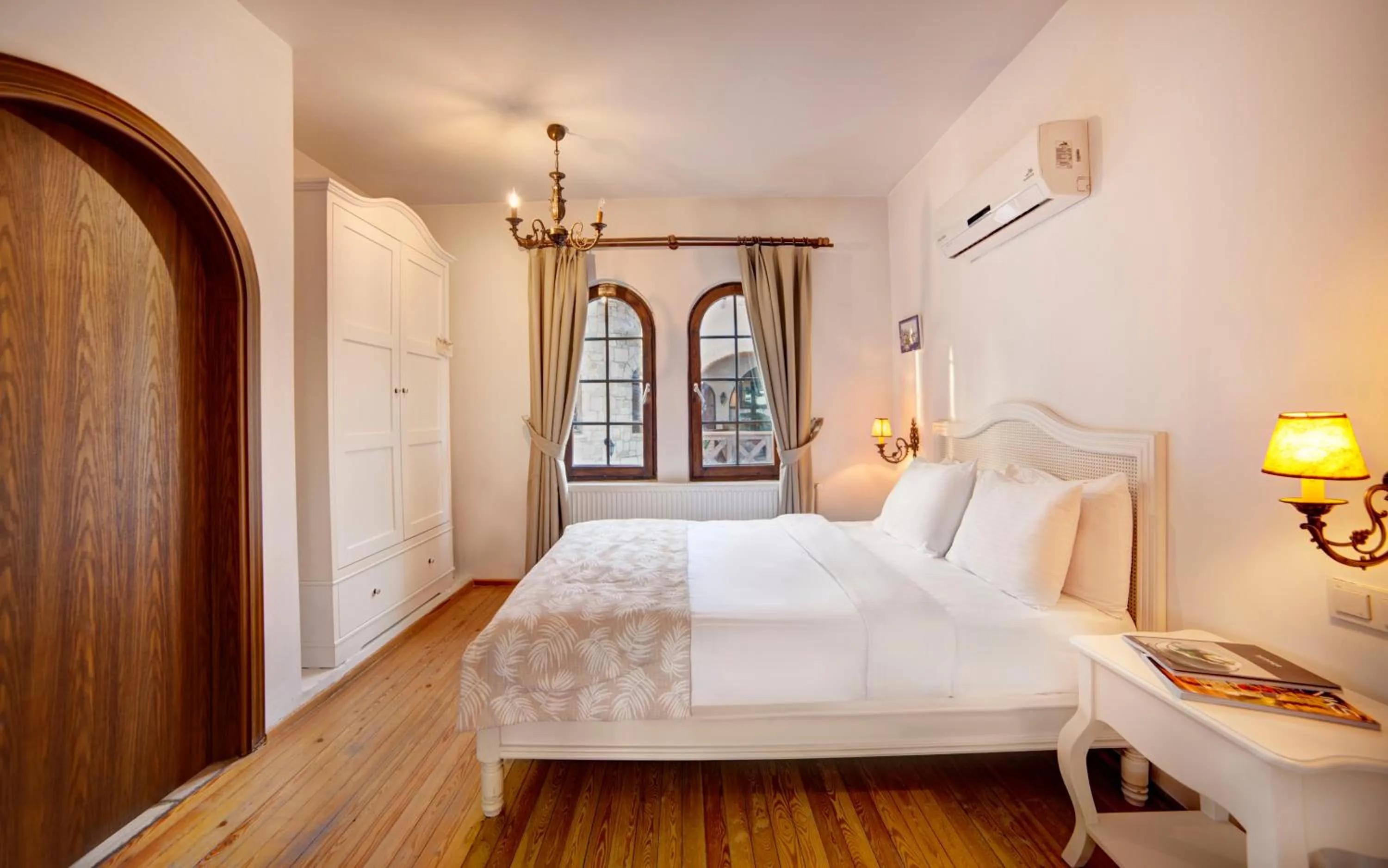 Bed in VINIFERA VINEYARDS HOTEL