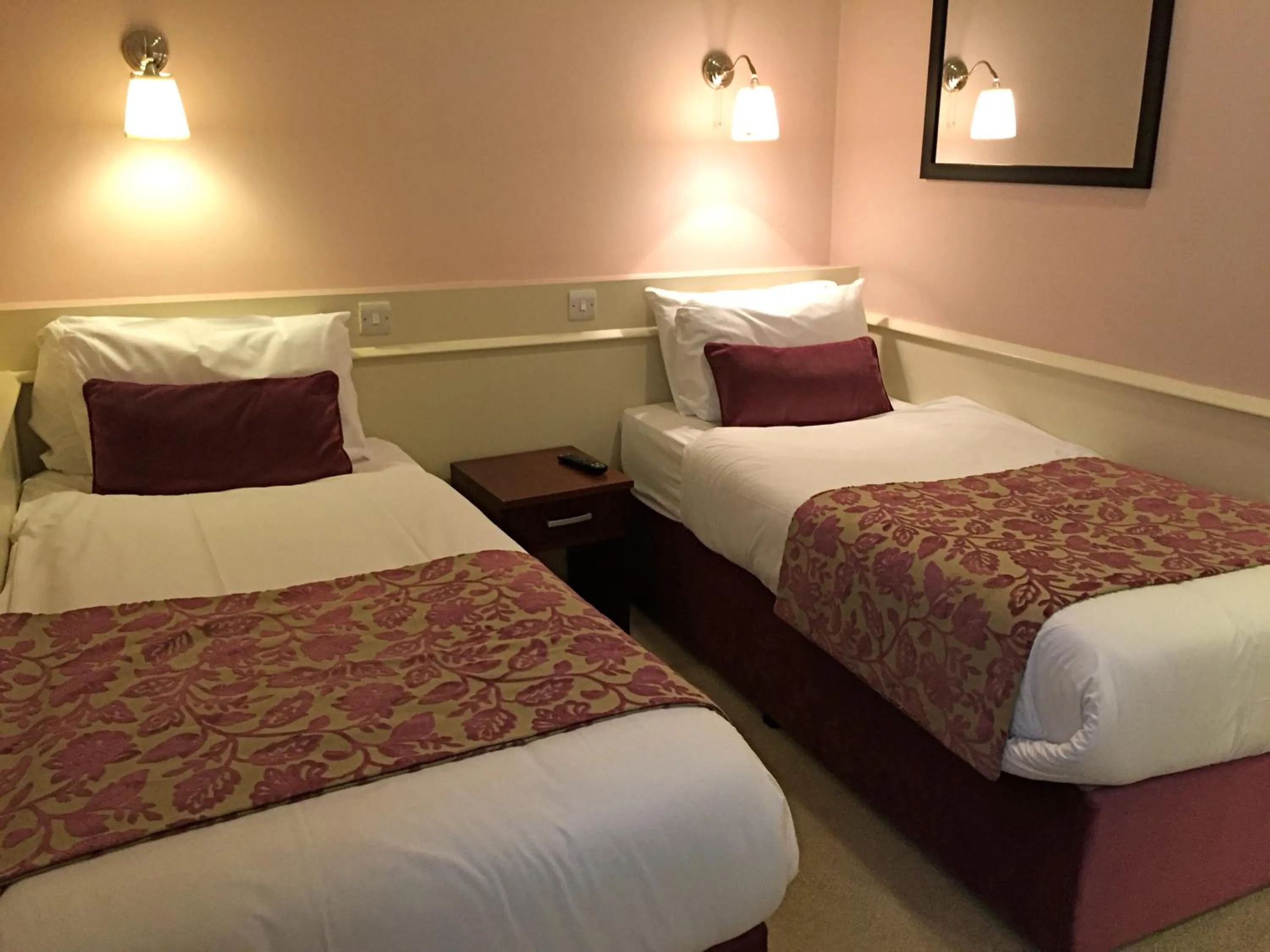 Bed in Maples House Hotel