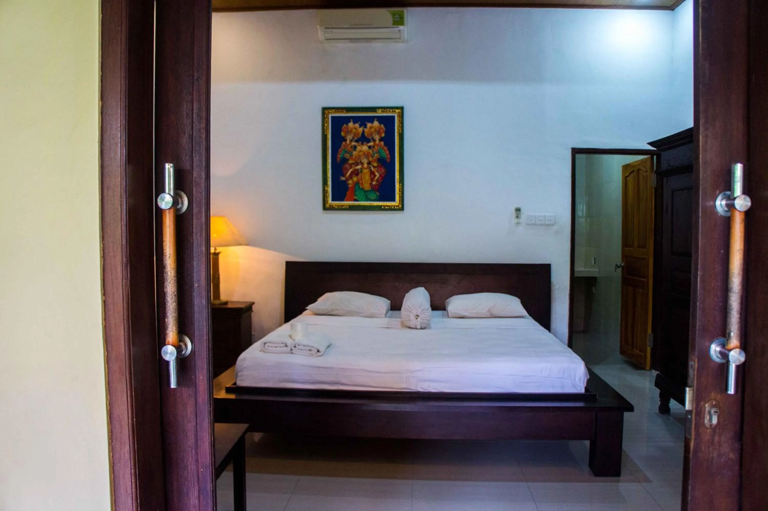 Bed in Putu Guest House