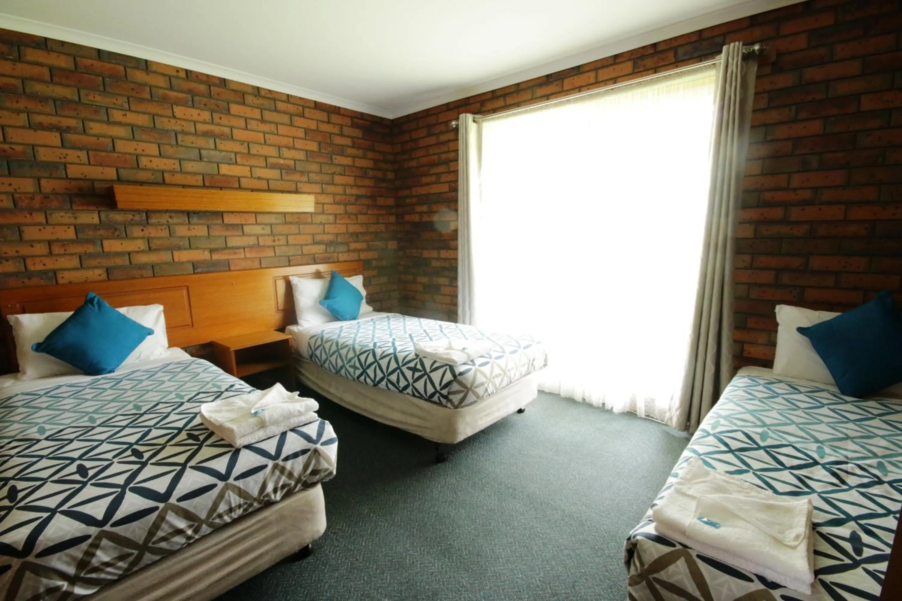 Bed in Golden Palms Motel