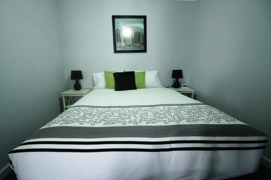 Bed in Golden Palms Motel