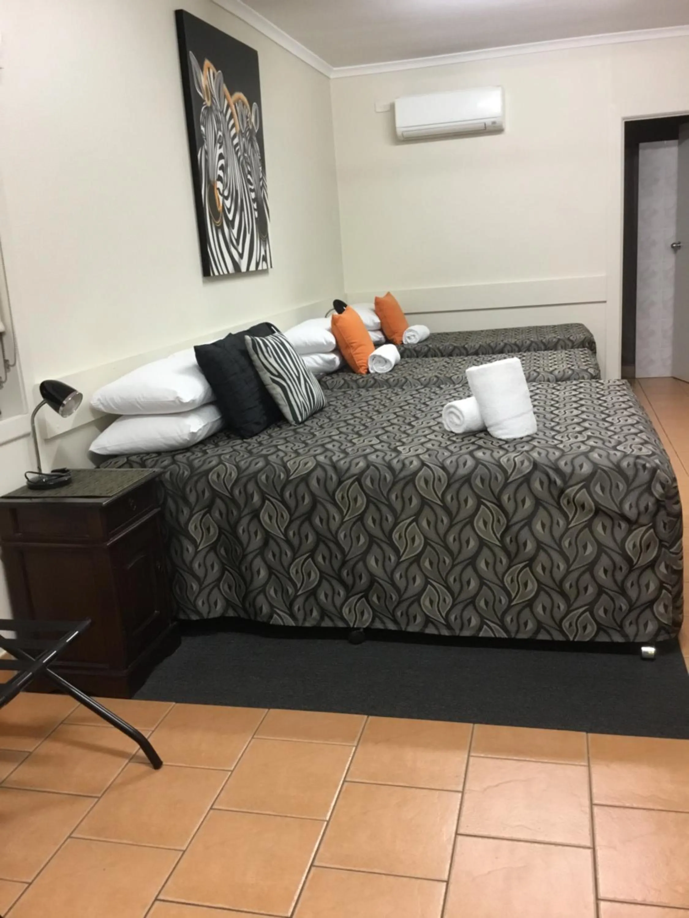 Bed in Golden Palms Motor Inn