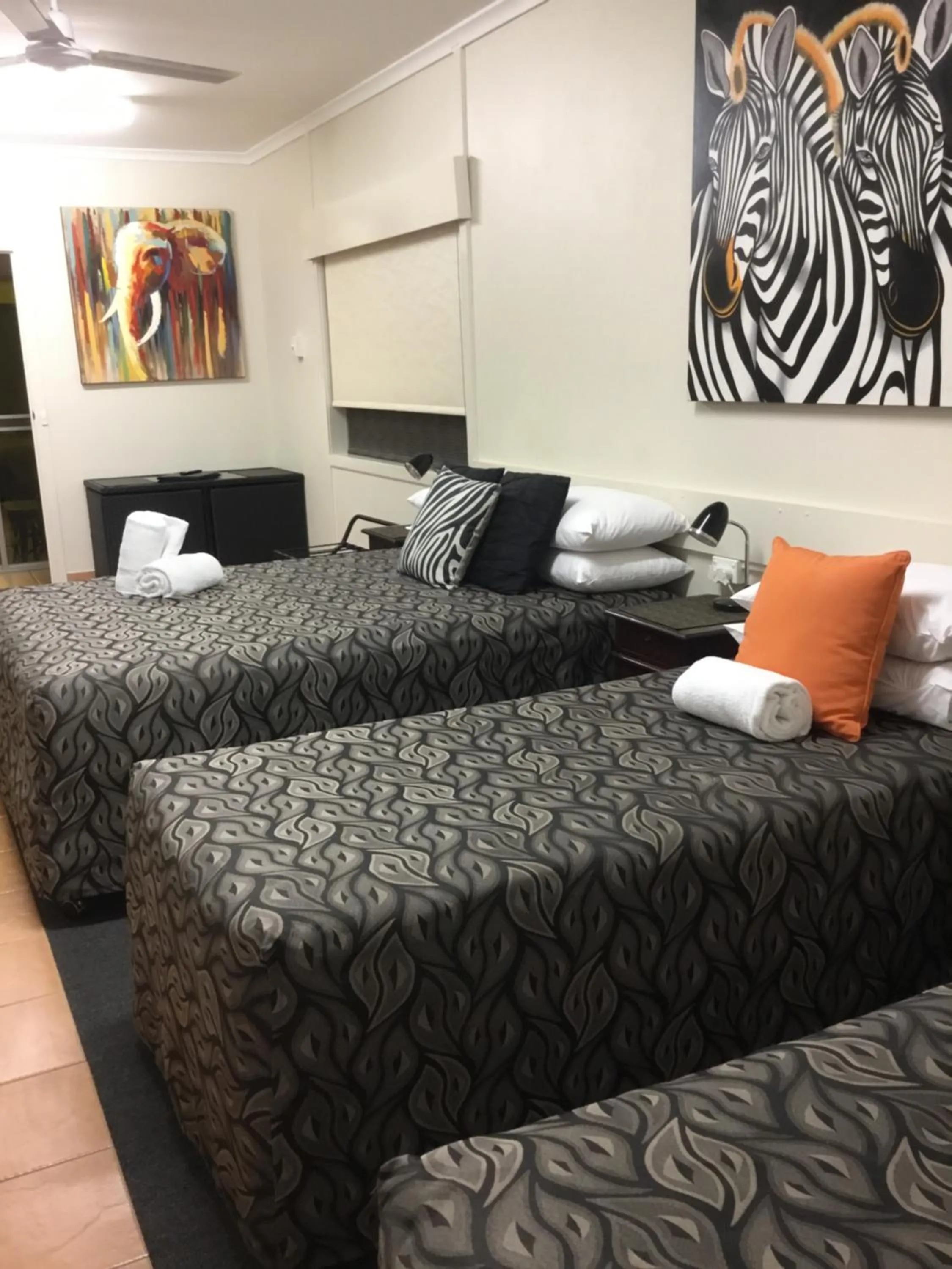 Bed in Golden Palms Motor Inn