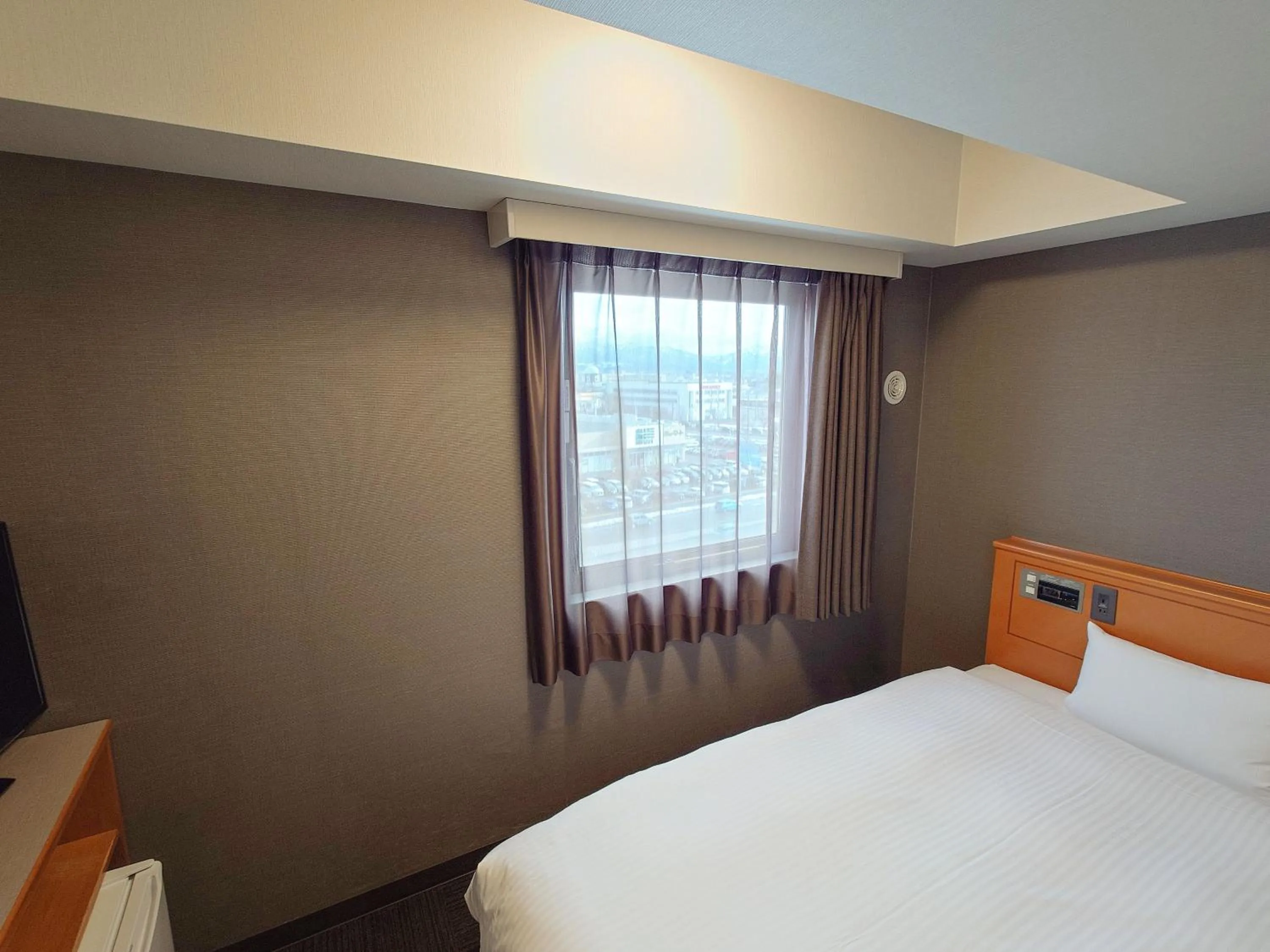 Photo of the whole room, Bed in Hotel Route-Inn Nagaoka Inter