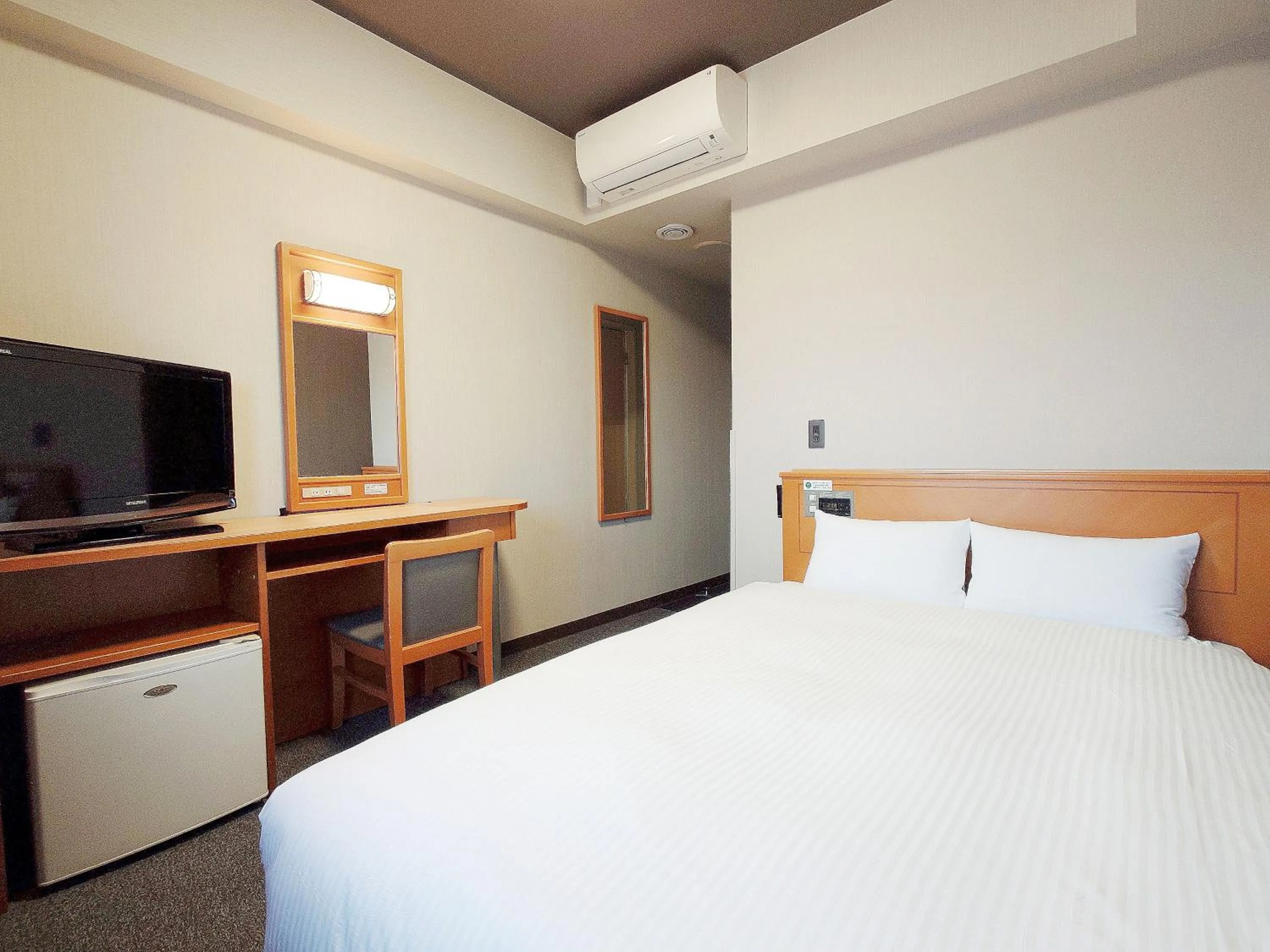 Photo of the whole room, Bed in Hotel Route-Inn Nagaoka Inter