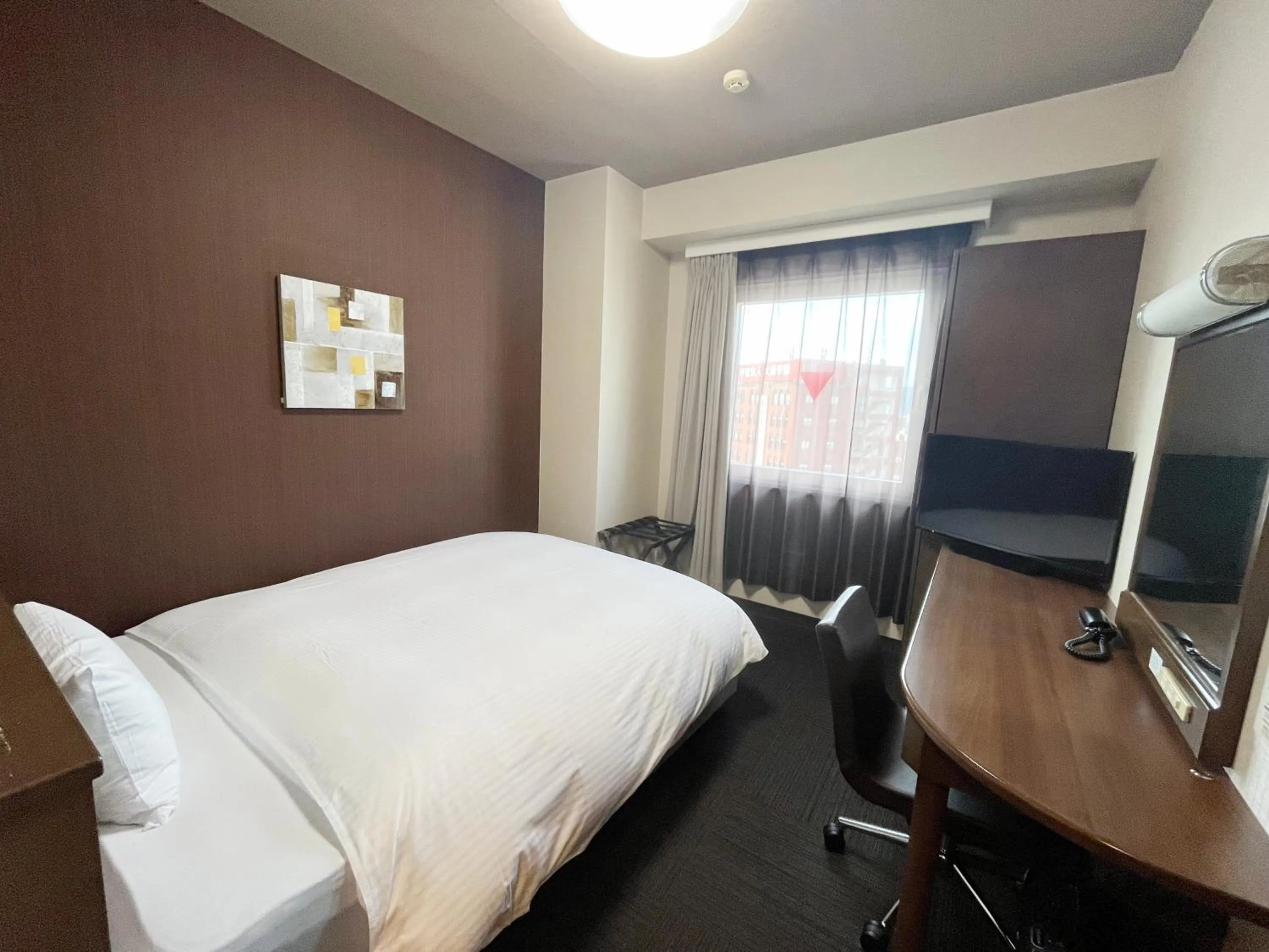 Photo of the whole room, Bed in Hotel Route-Inn Fukui Ekimae