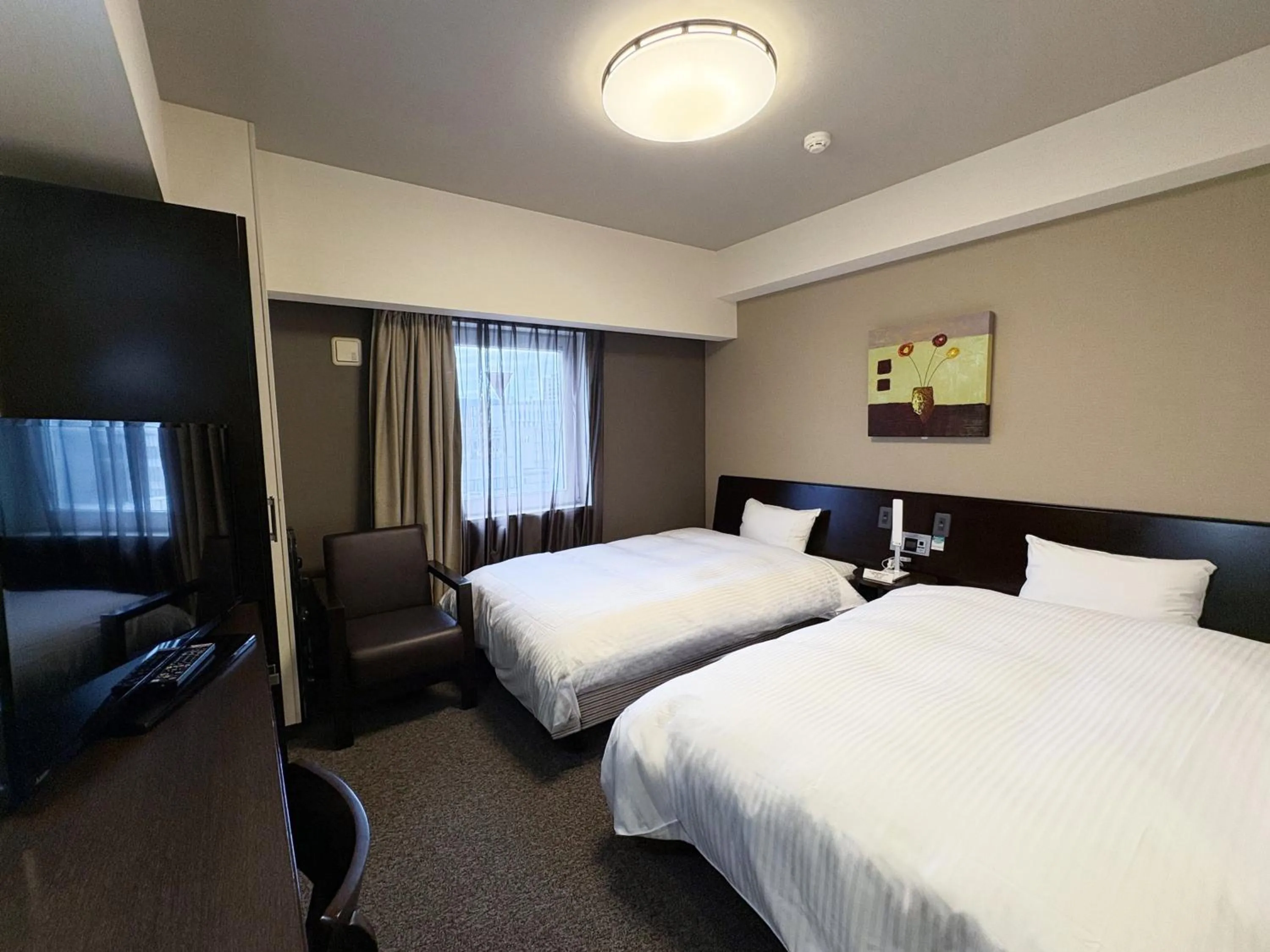 Photo of the whole room, Bed in Hotel Route-Inn Iwaki Ekimae