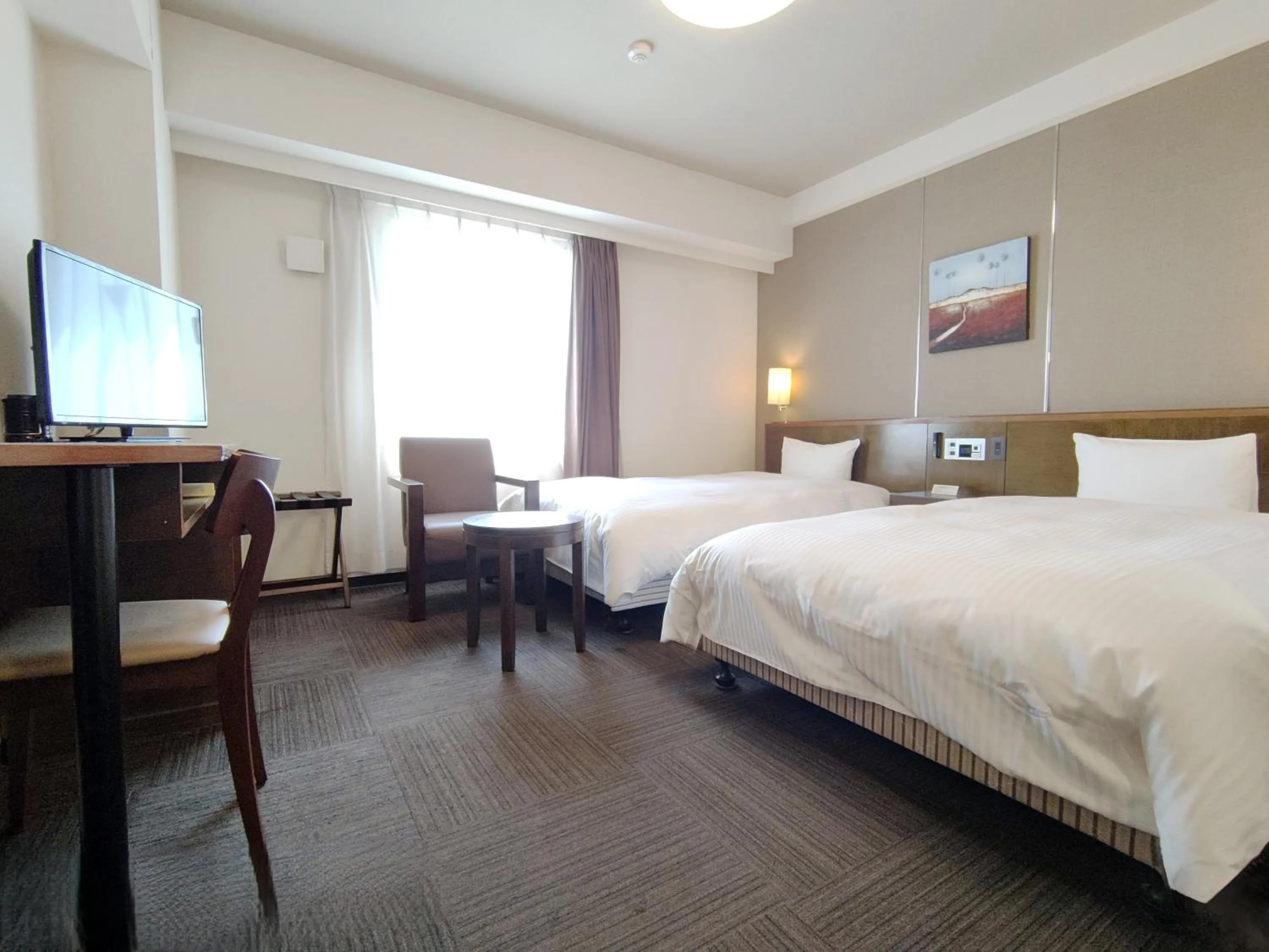 Photo of the whole room, Bed in Hotel Route-Inn Iwakiizumi Ekimae