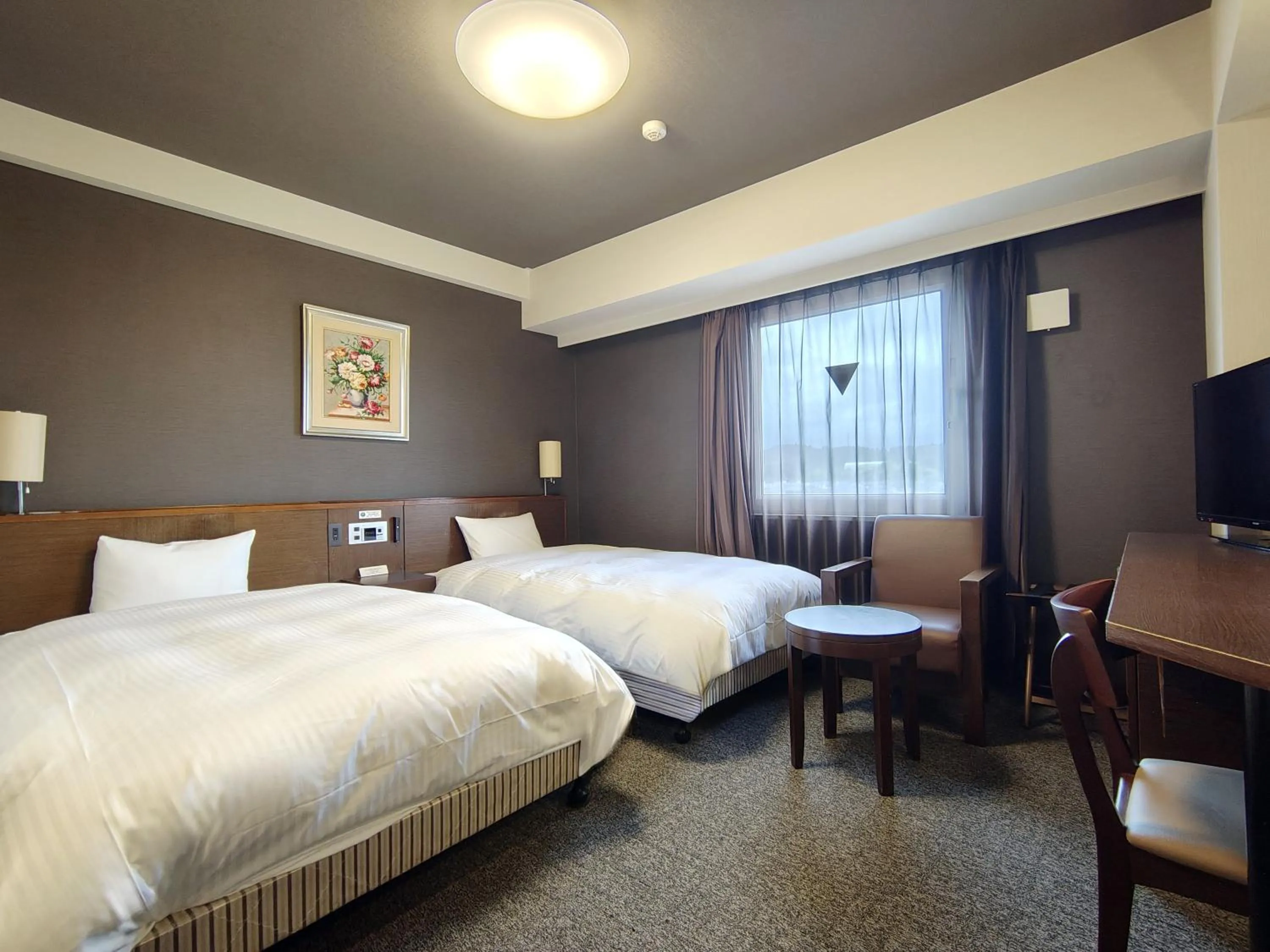 Photo of the whole room, Bed in Hotel Route-Inn Iwakiizumi Ekimae