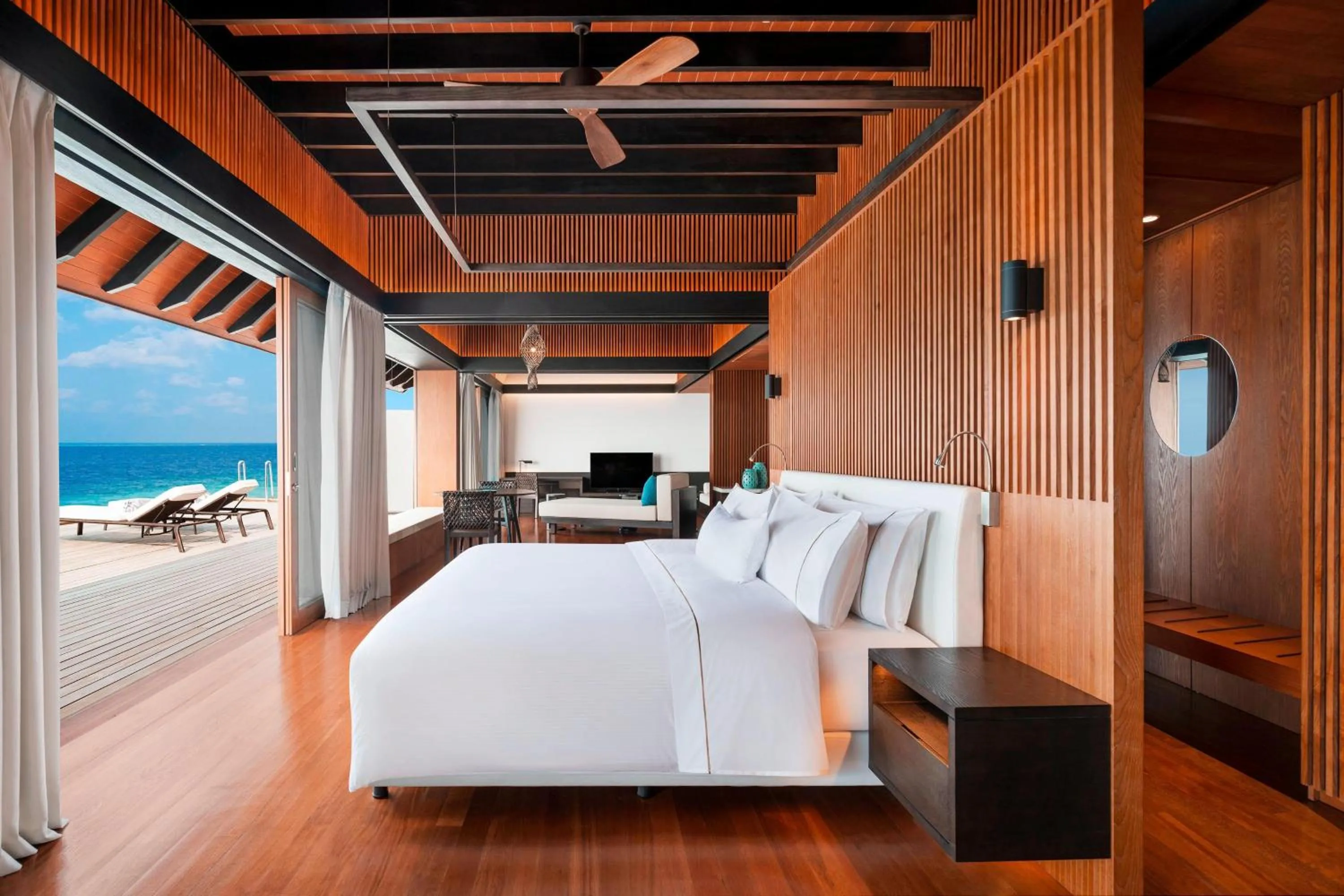 Swimming pool, Bed in The Westin Maldives Miriandhoo Resort