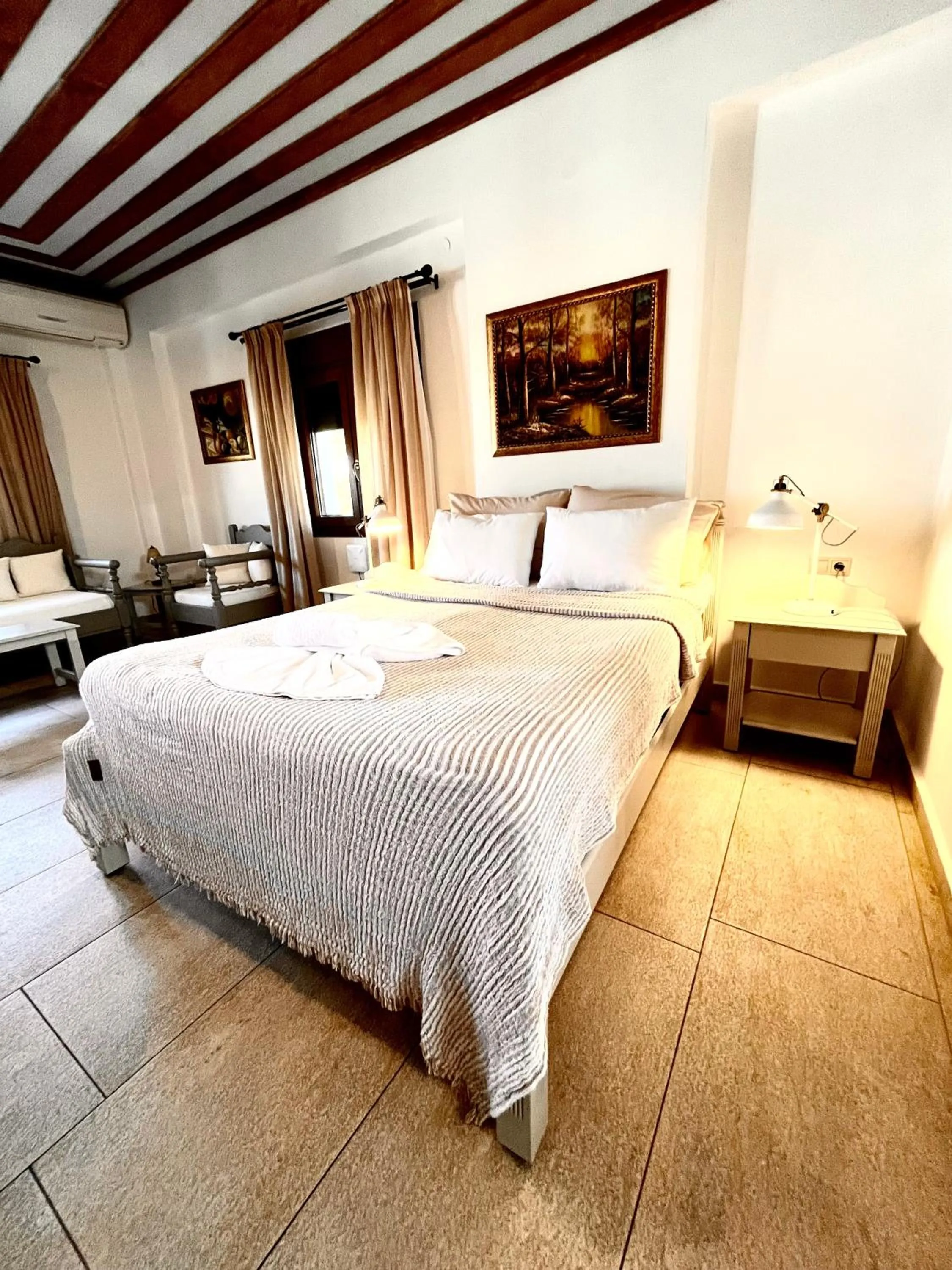 Bed in Pantheon Apartments & Studios