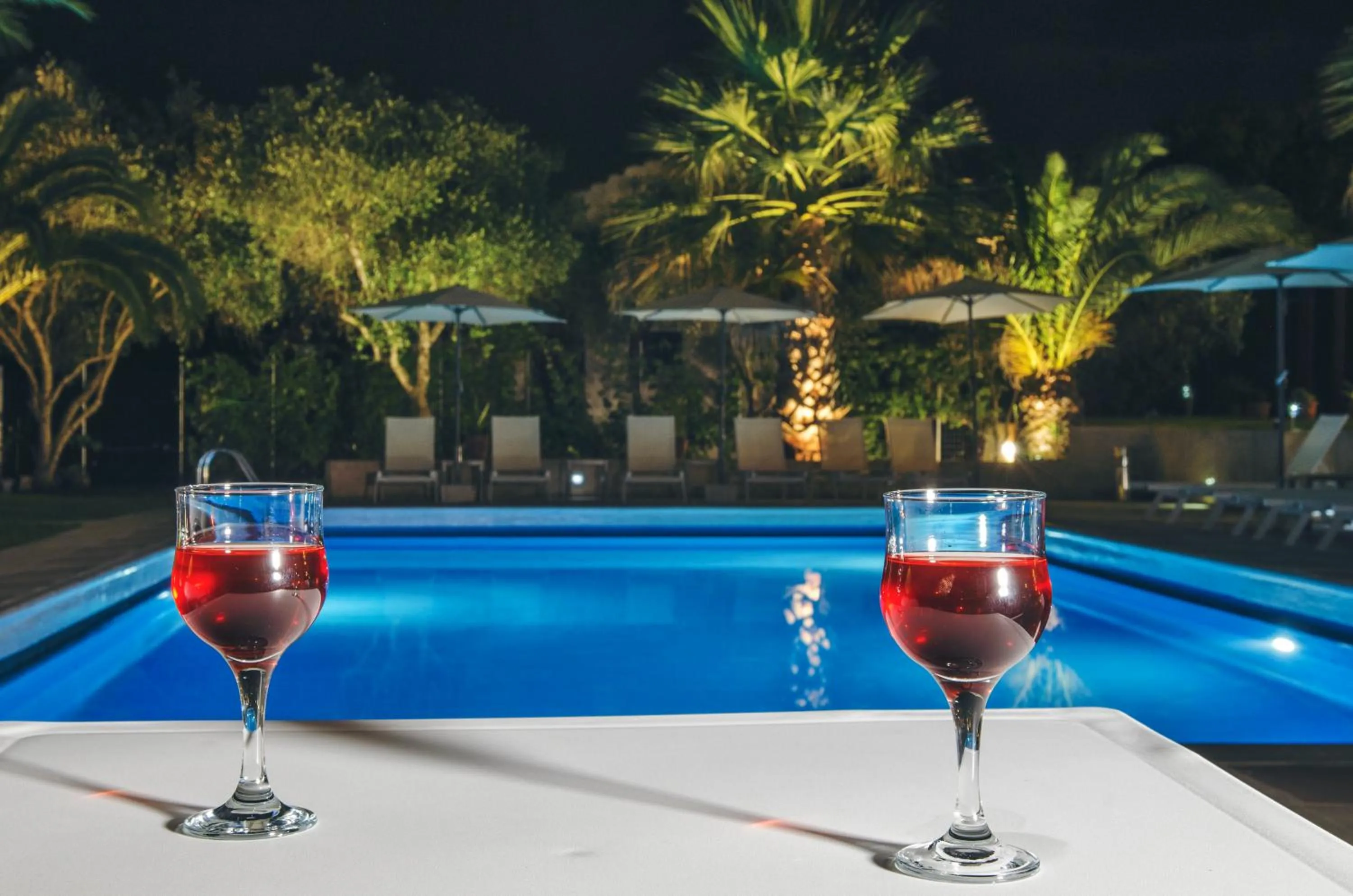 Patio in The Palm Garden - Idyllic Pool Apartments in a Green Oasis