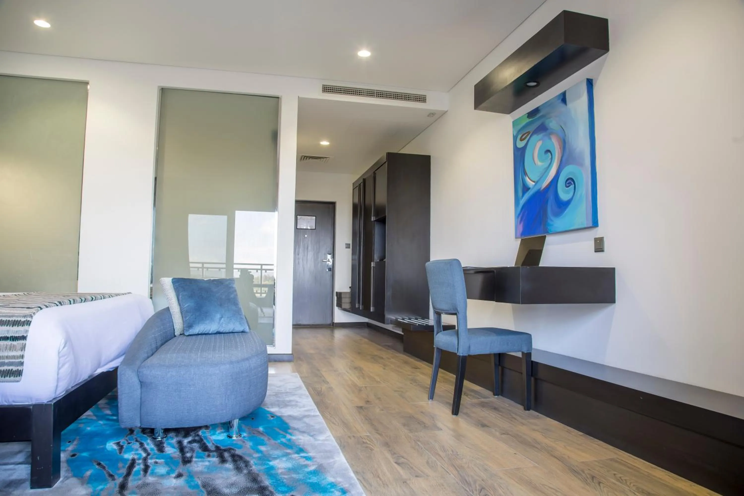 Communal lounge/ TV room in Amaryllis Hotel Blantyre