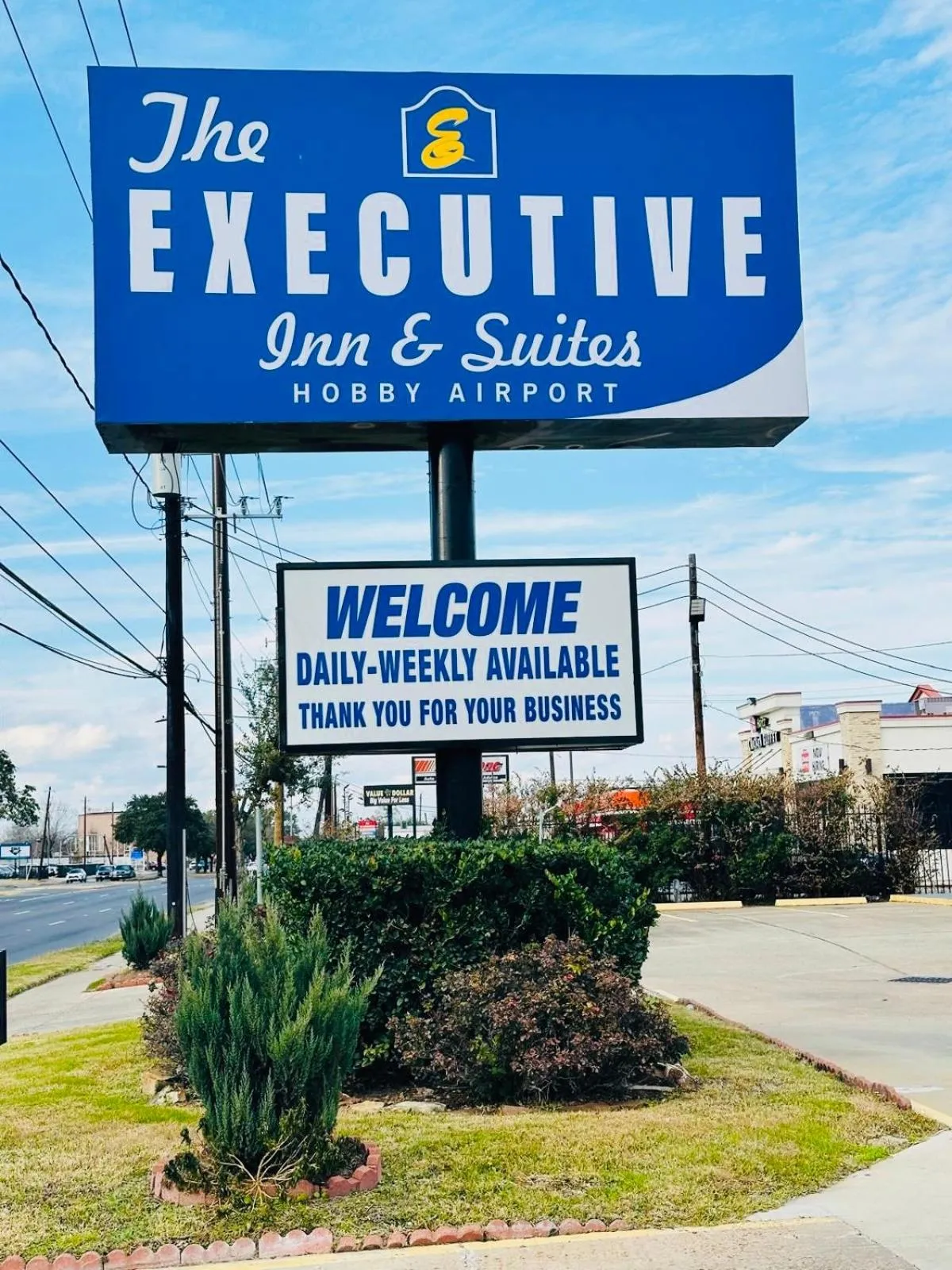 Property logo or sign in Executive Inn and Suites Houston
