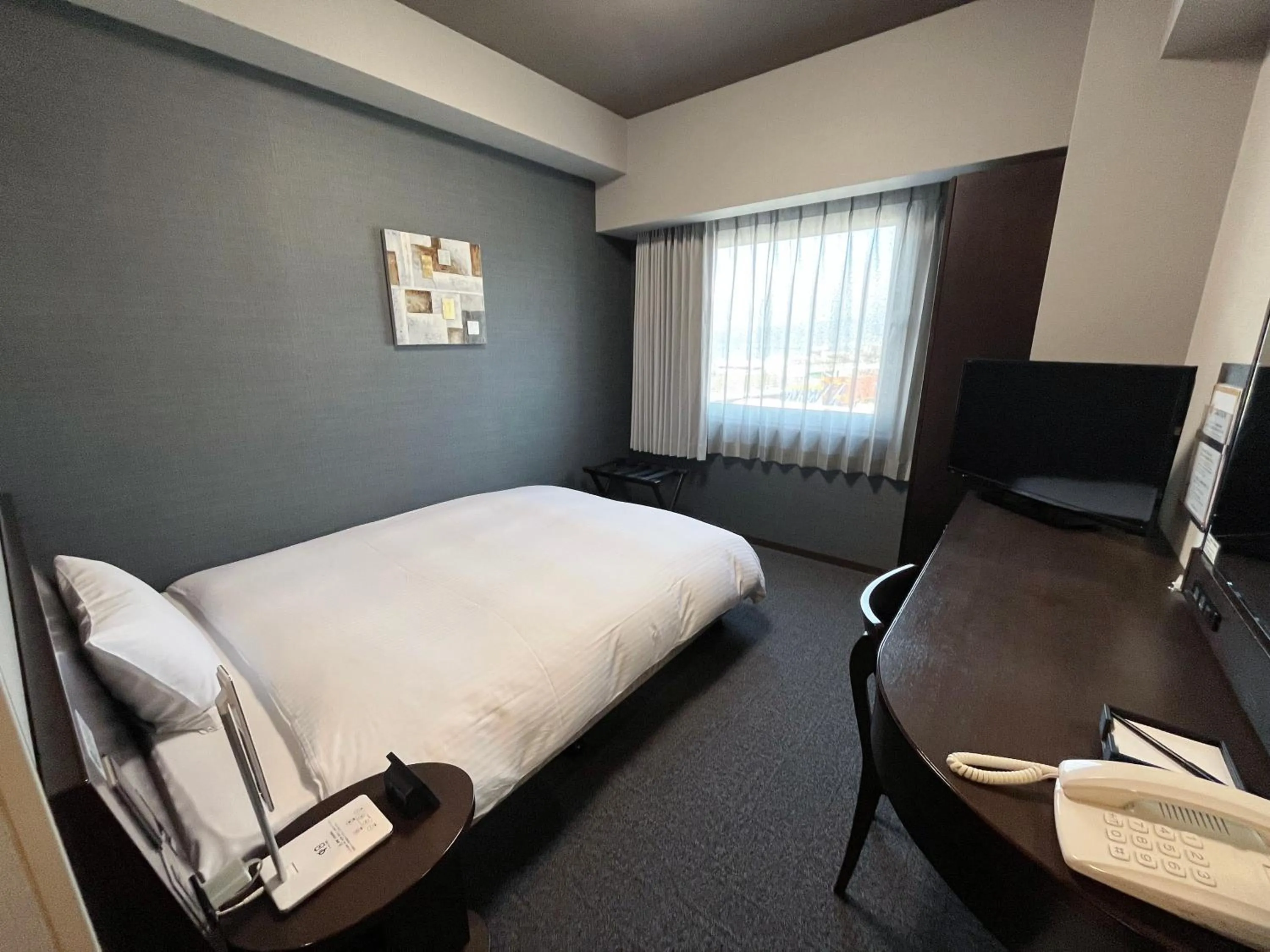 Photo of the whole room, Bed in Hotel Route-Inn Sakaide-Kita Inter