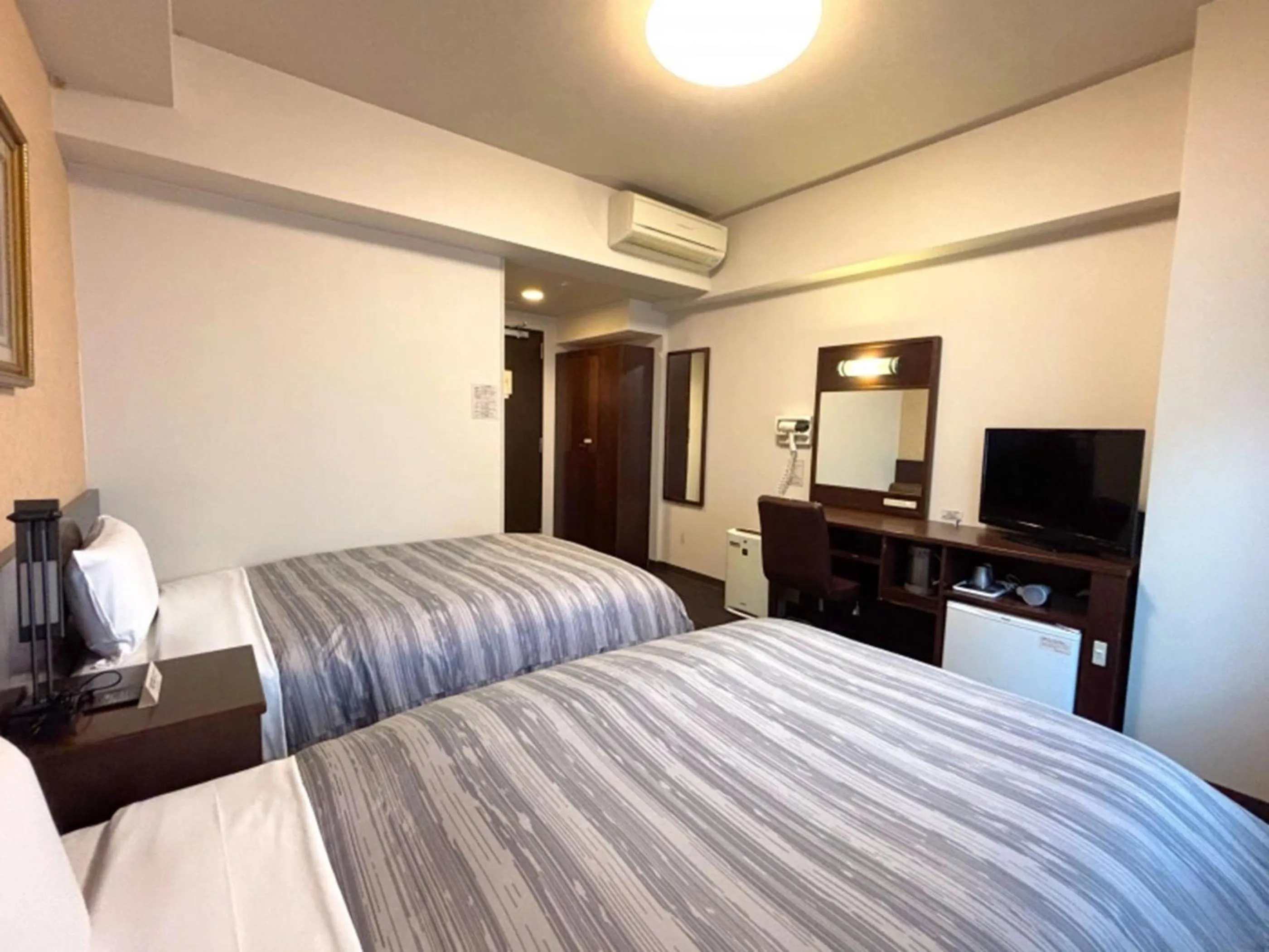Photo of the whole room, Bed in Hotel Route-Inn Tokuyama Ekimae