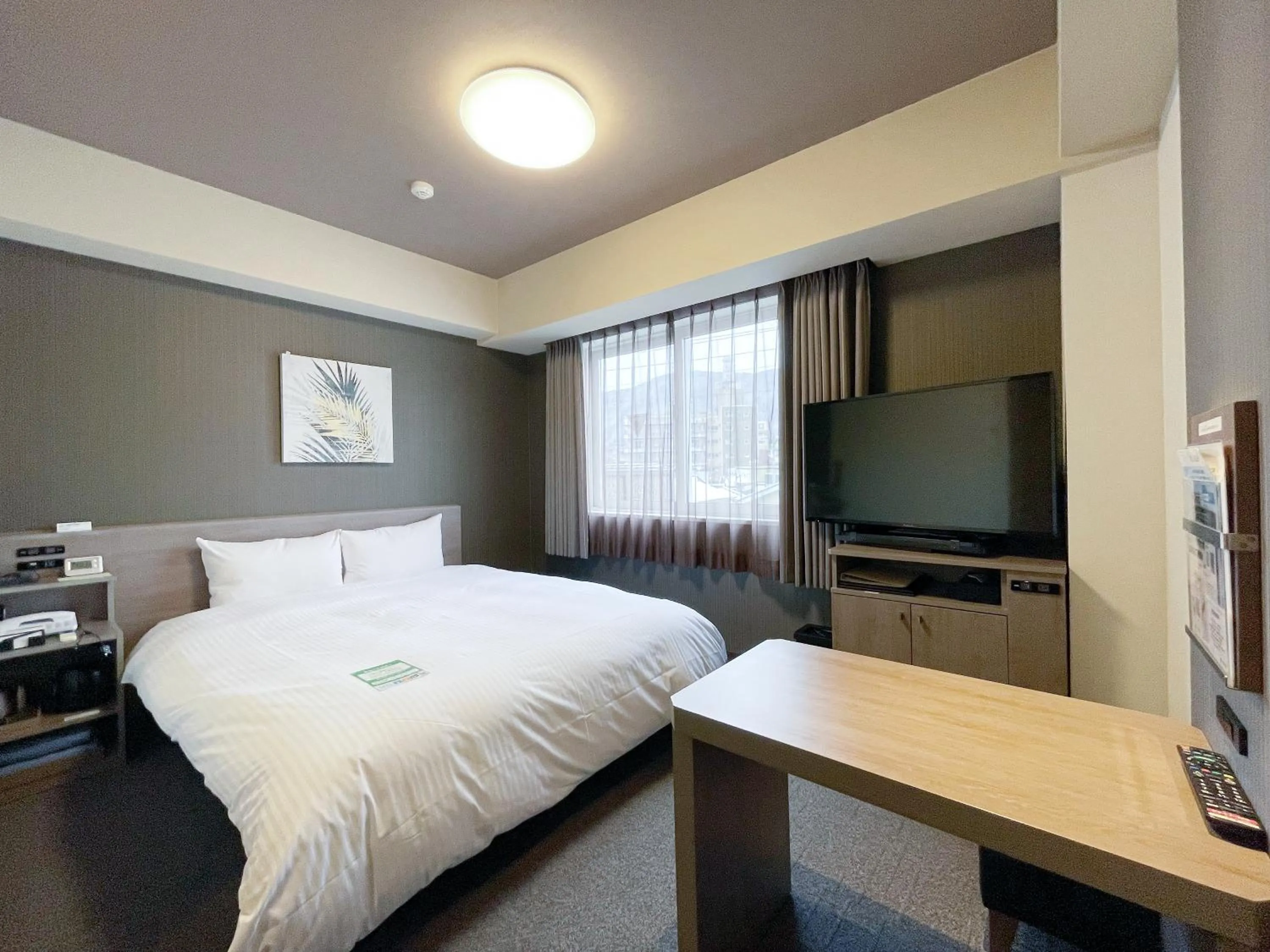 Photo of the whole room, Bed in HOTEL ROUTE-INN Kamiyamada Onsen