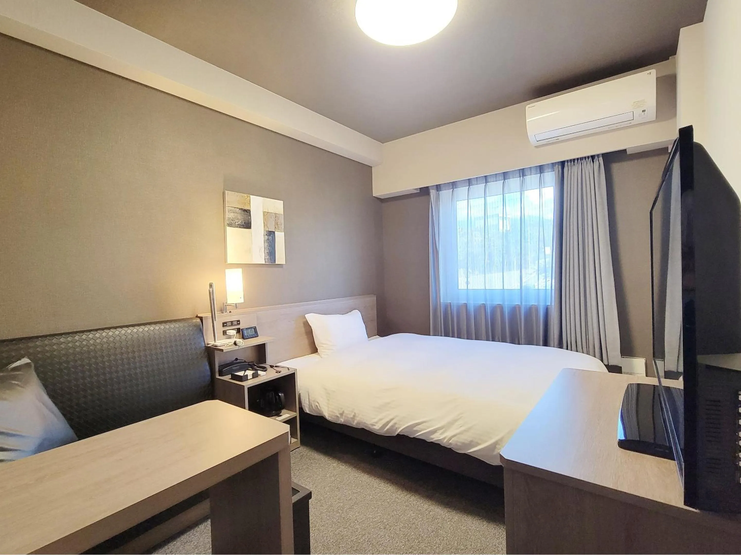 Photo of the whole room, Bed in Hotel Route-Inn Komoro