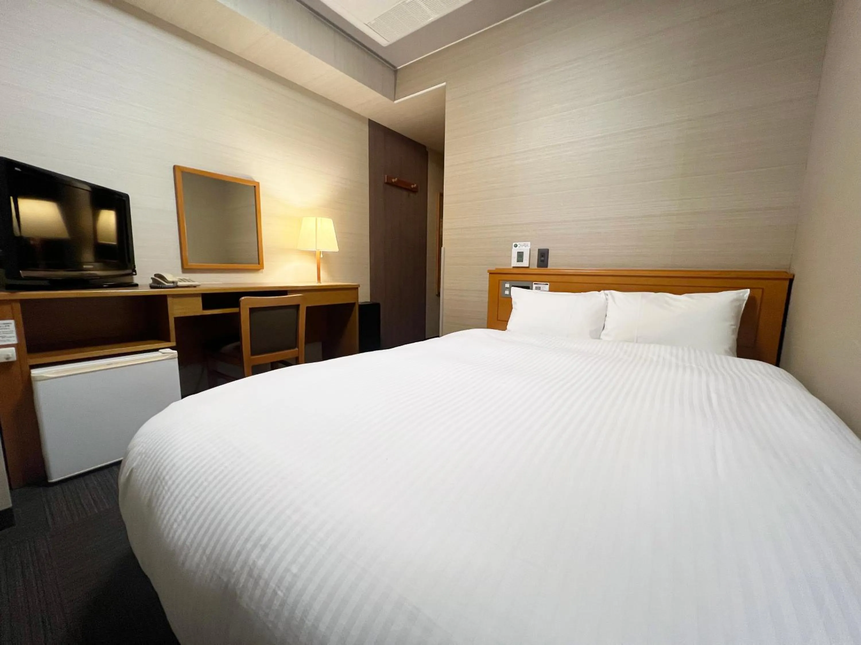 Photo of the whole room, Bed in Hotel Route-Inn Tsuruoka Inter