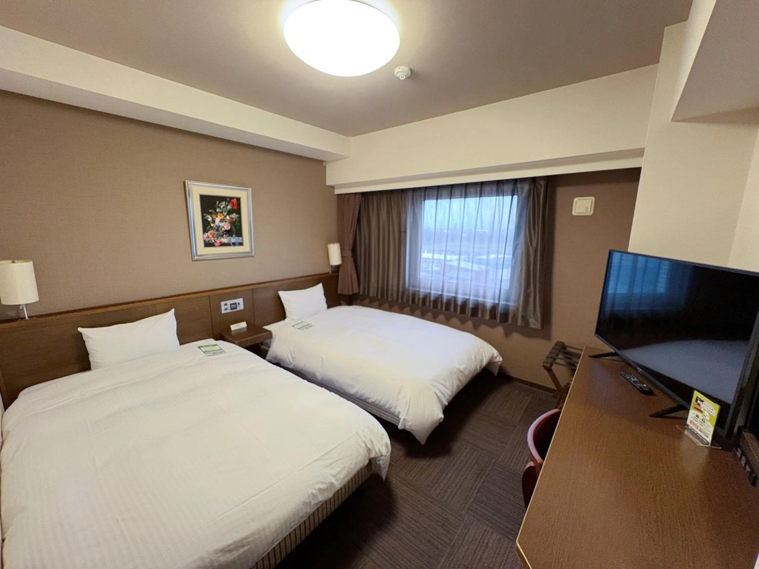 Photo of the whole room, Bed in Hotel Route-Inn Tsuruoka Ekimae
