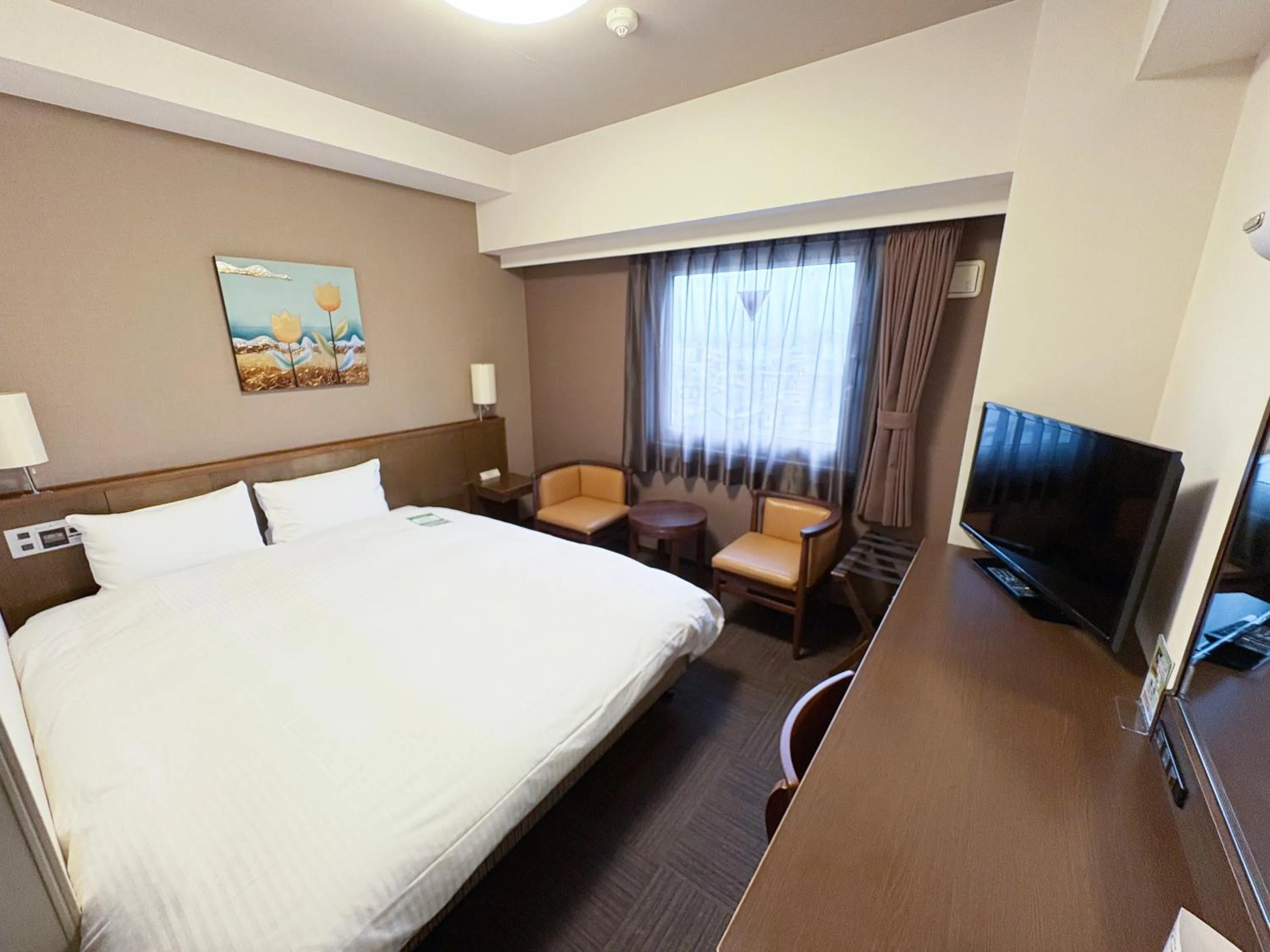 Photo of the whole room, Bed in Hotel Route-Inn Tsuruoka Ekimae