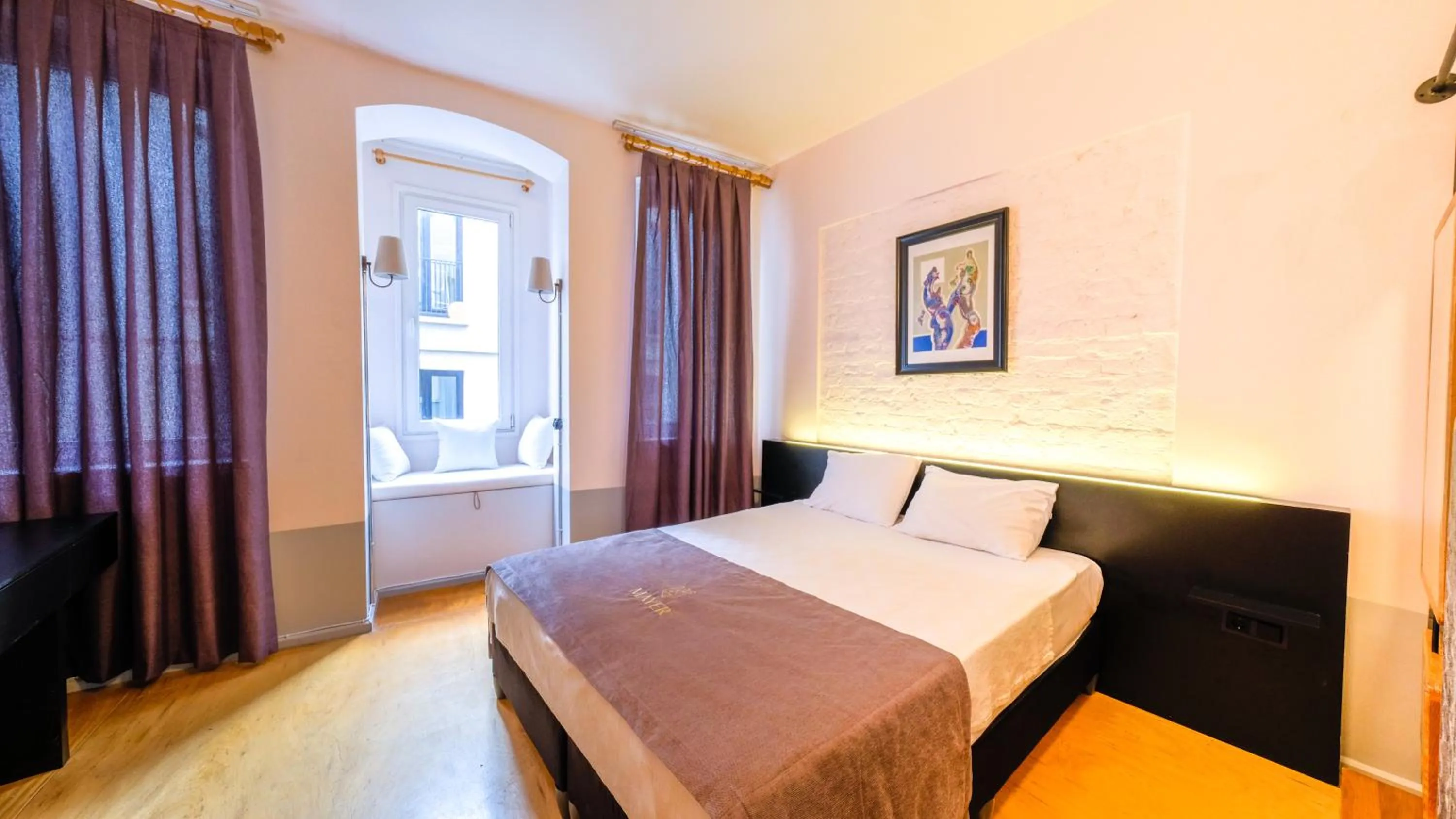 Bed in Mayer Loft Suites