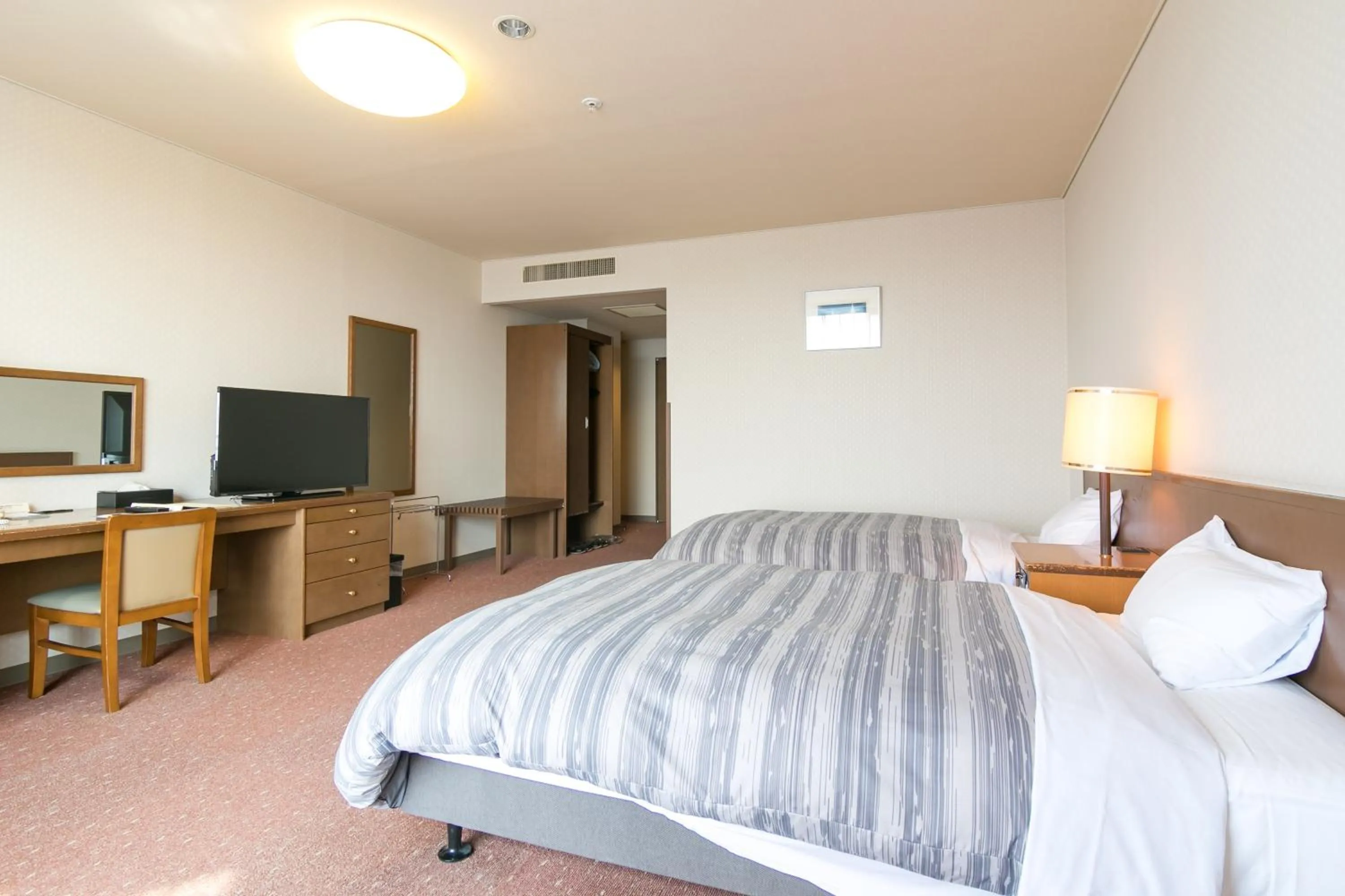 Photo of the whole room, Bed in Tokachi Makubetsu Onsen Grandvrio Hotel