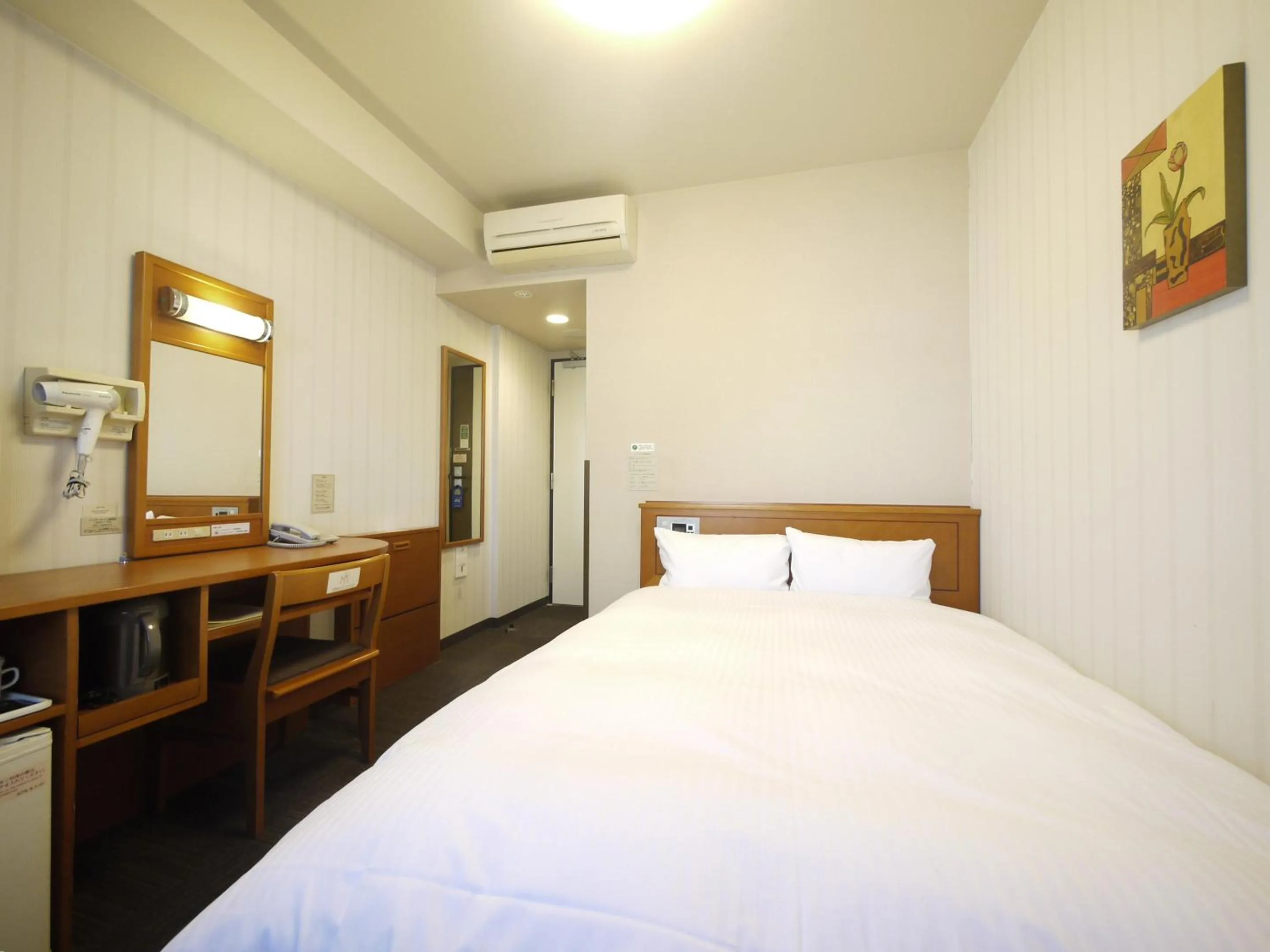 Photo of the whole room, Bed in Hotel Route-Inn Saga Ekimae