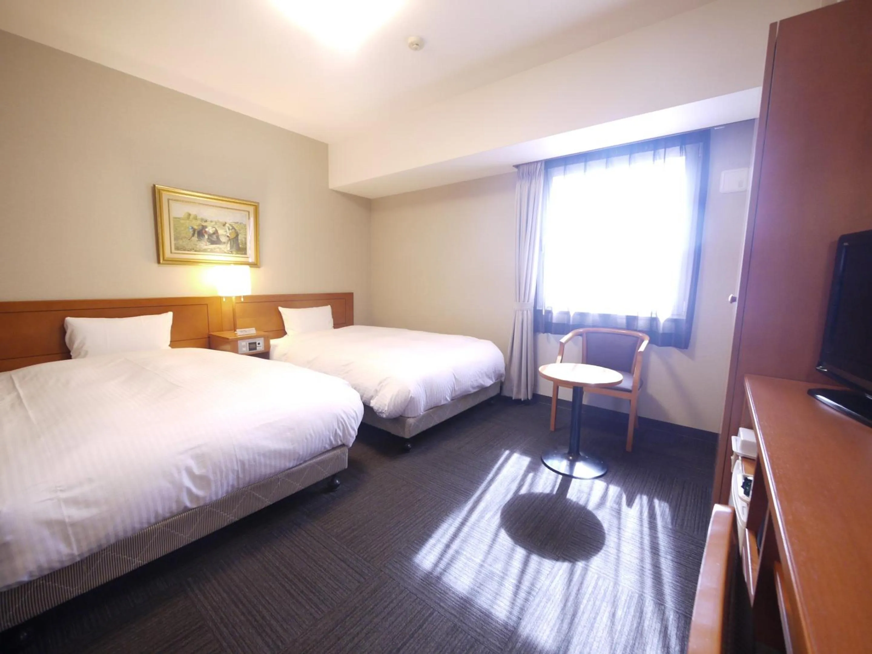 Photo of the whole room, Bed in Hotel Route-Inn Saga Ekimae