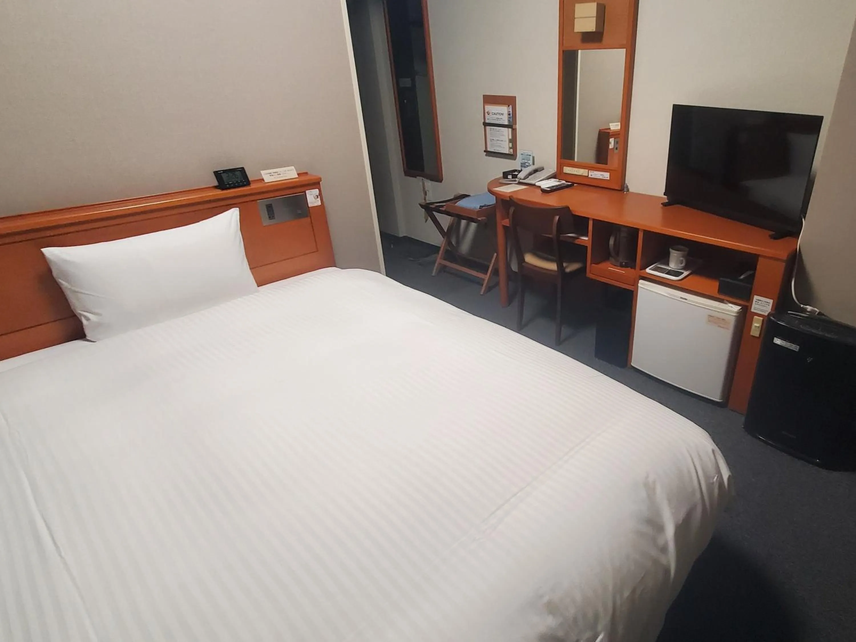 Photo of the whole room, Bed in Hotel Route-Inn Saga Ekimae