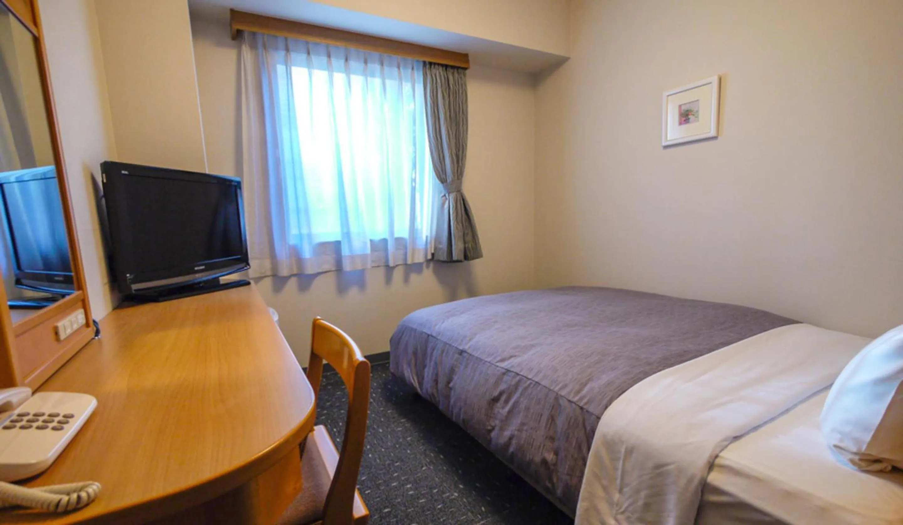 Bed in Hotel Route-Inn Oita Ekimae