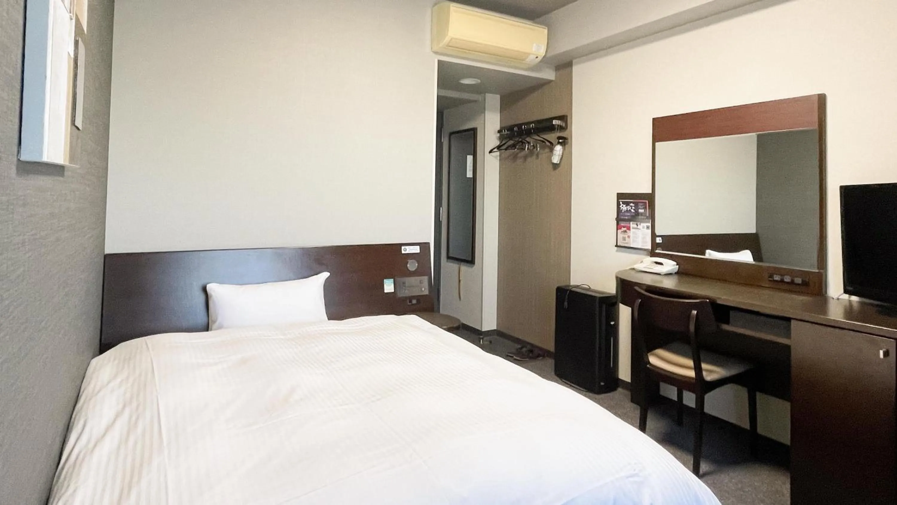 Photo of the whole room, Bed in Hotel Route-Inn Mitsukaido Ekimae
