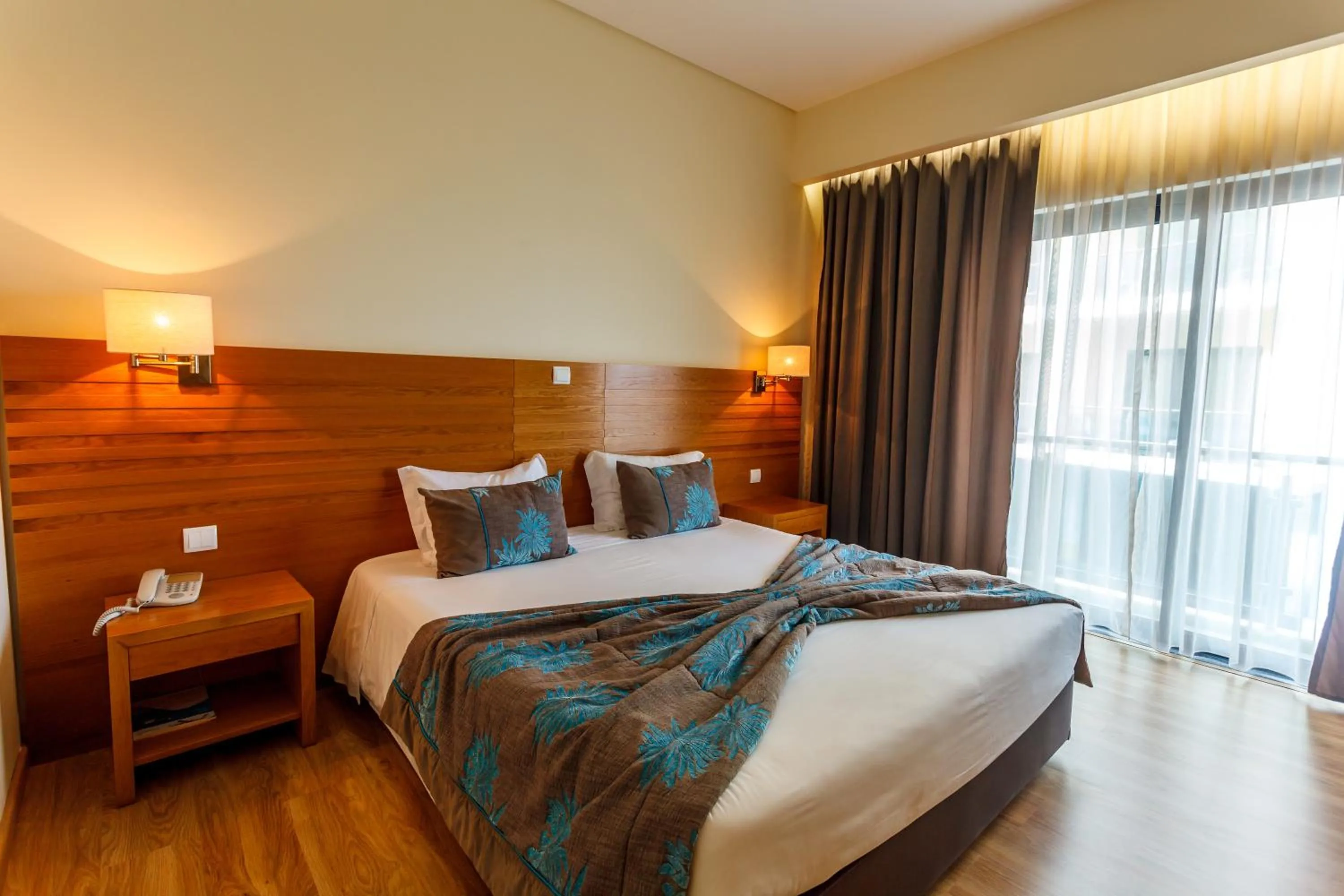 Bed in Hotel Caravelas