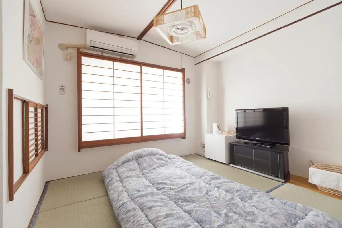 Photo of the whole room, Bed in Shin Okubo Sekitei