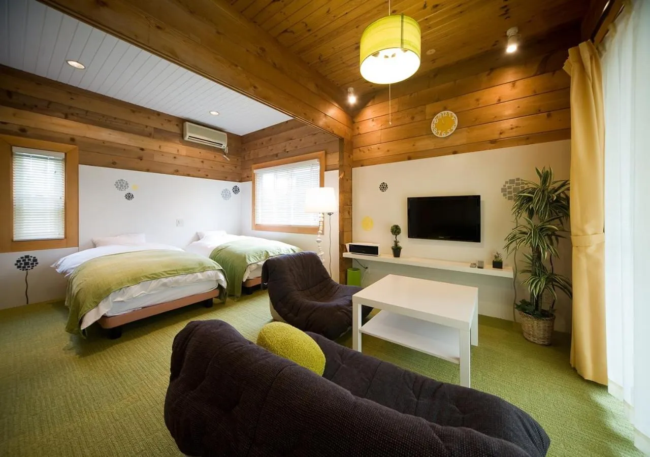 Living room, Bed in Holiday House Green Garden