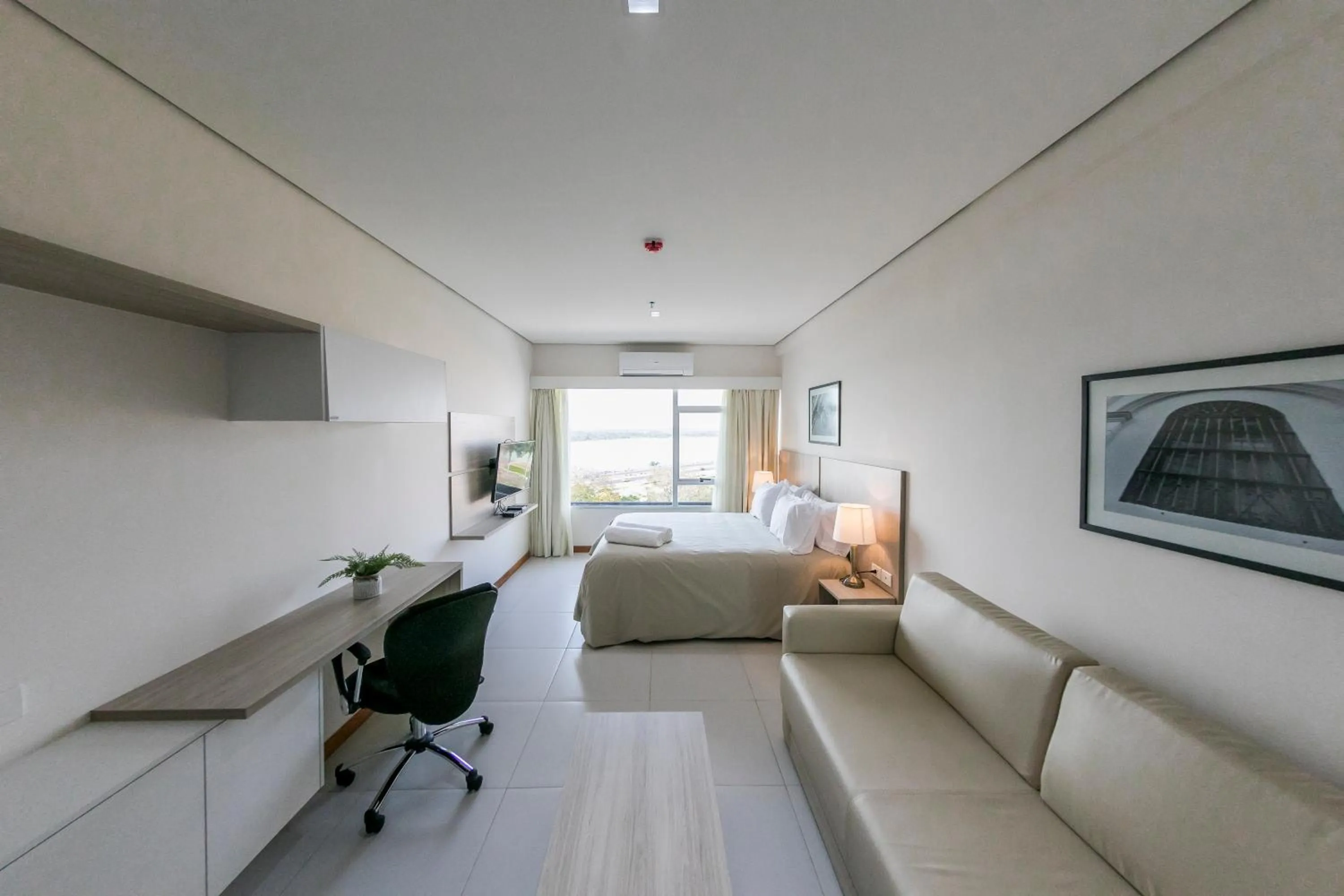 Living room, Bed in Asuncion Rent Suites Centro