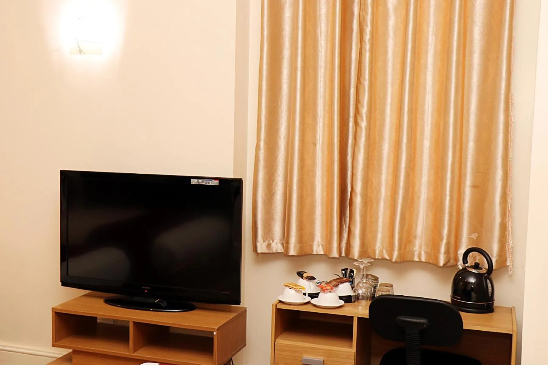 TV/Entertainment Center in Gatwick Inn Hotel - For A Peaceful Overnight Stay