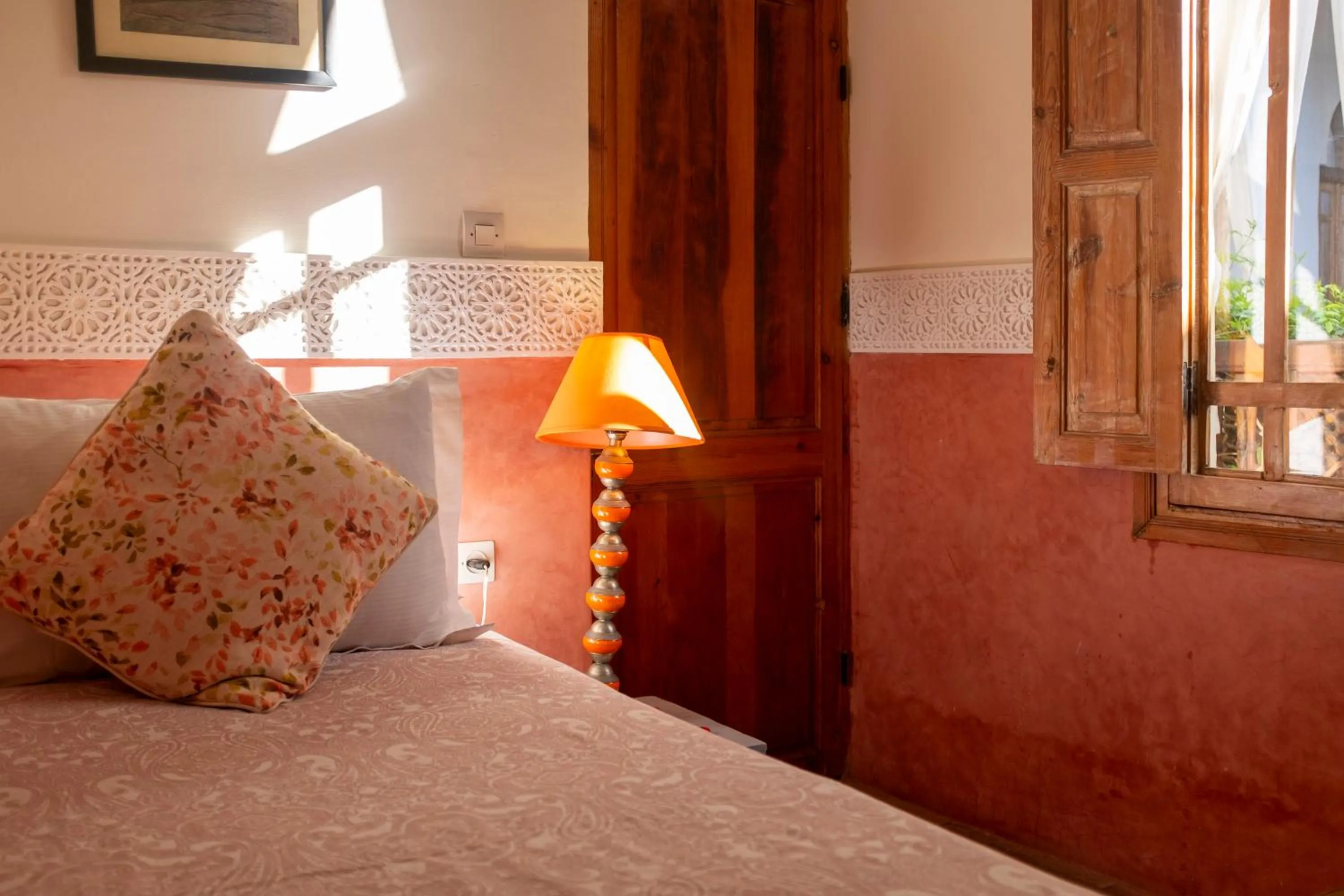 Bed in Riad Le Coq Berbère