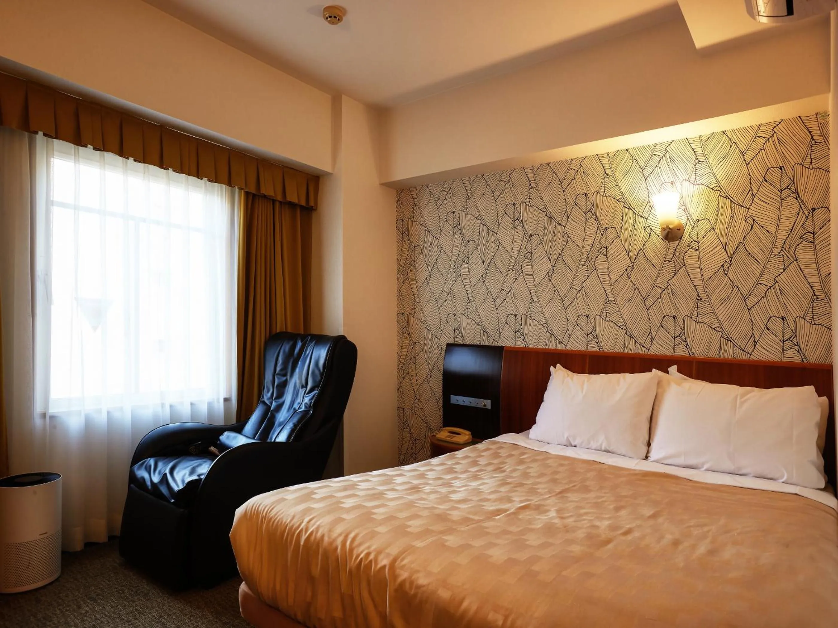 Photo of the whole room, Bed in GRG Hotel Naha Higashimachi