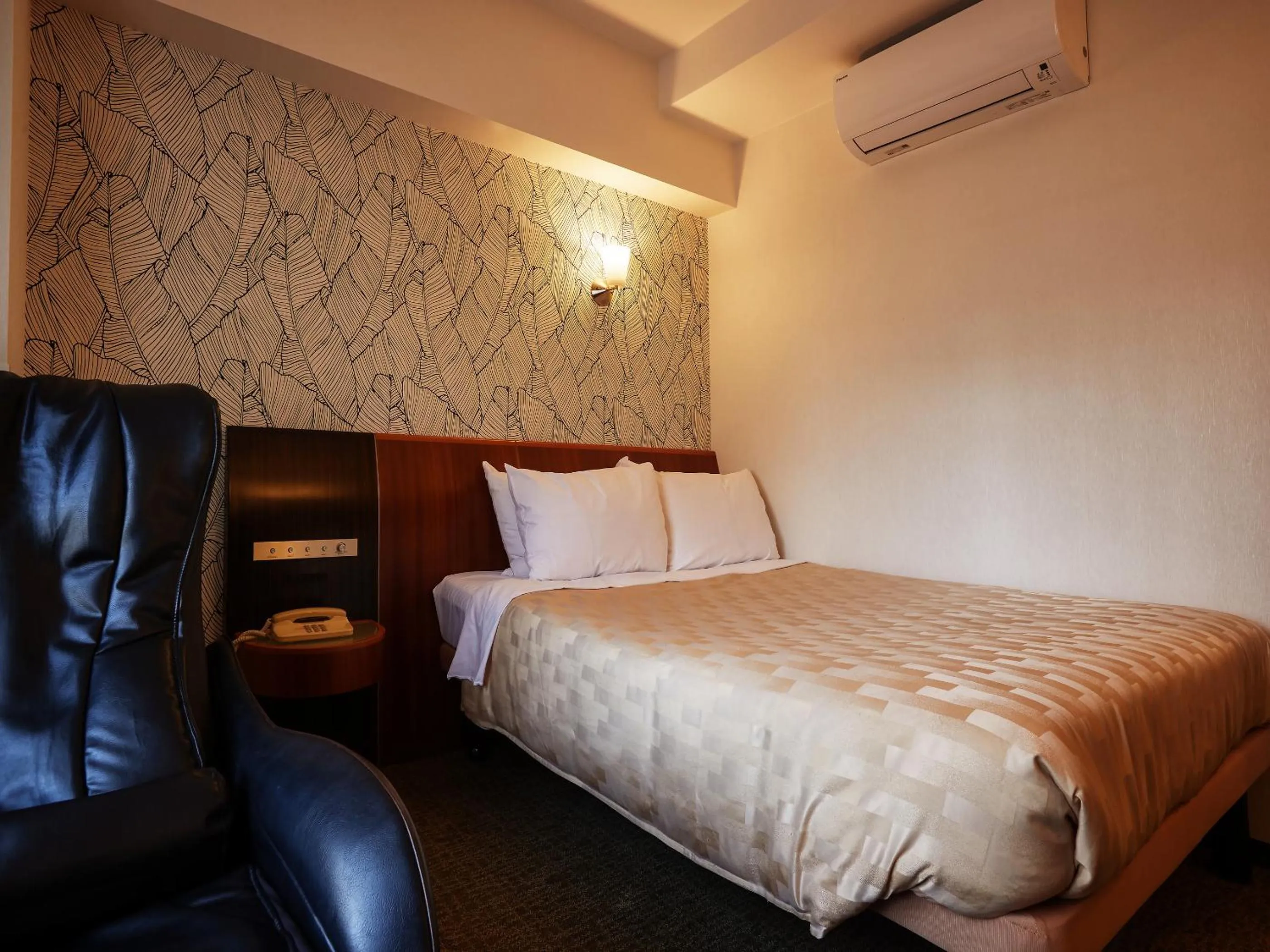 Photo of the whole room, Bed in GRG Hotel Naha Higashimachi