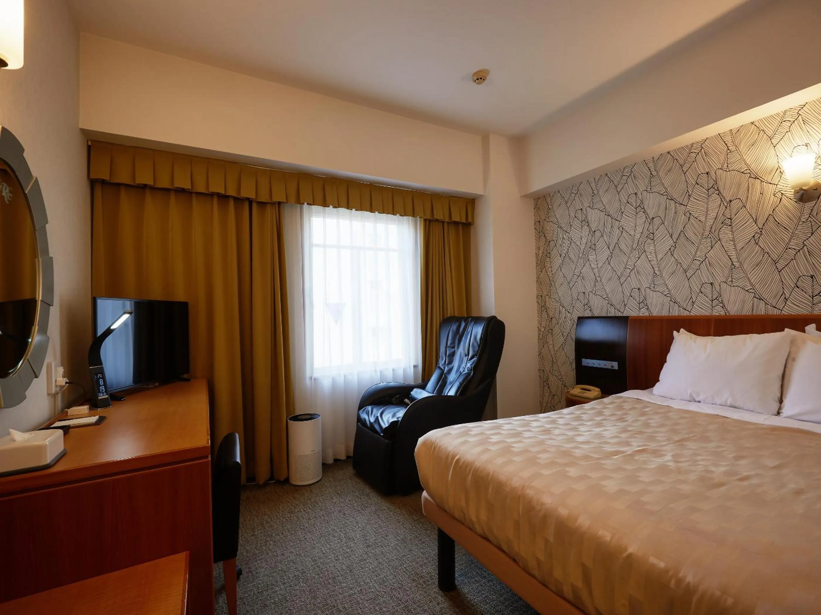 Photo of the whole room, Bed in GRG Hotel Naha Higashimachi