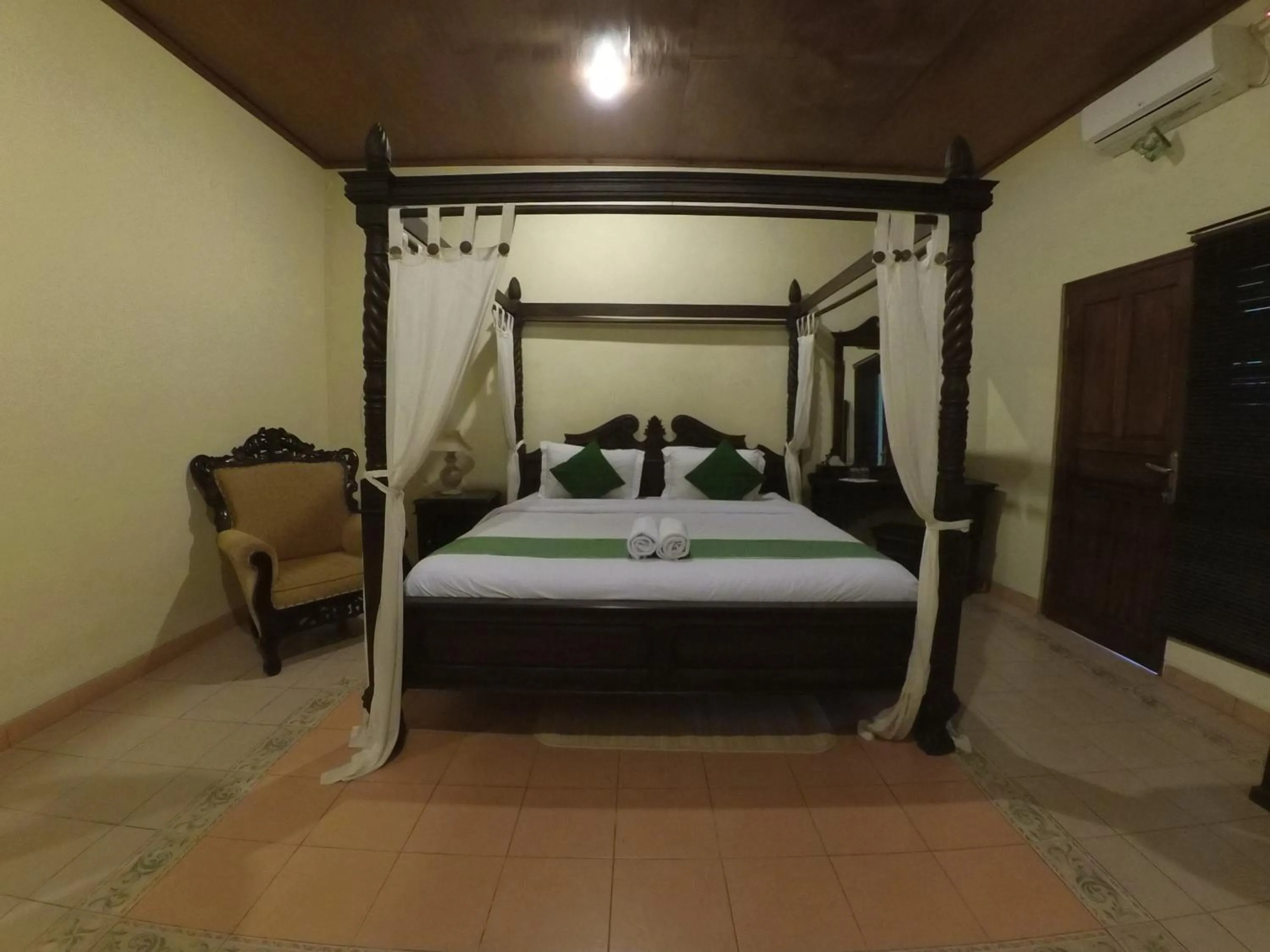 Bed in Alam Jogja Resort Mitra RedDoorz